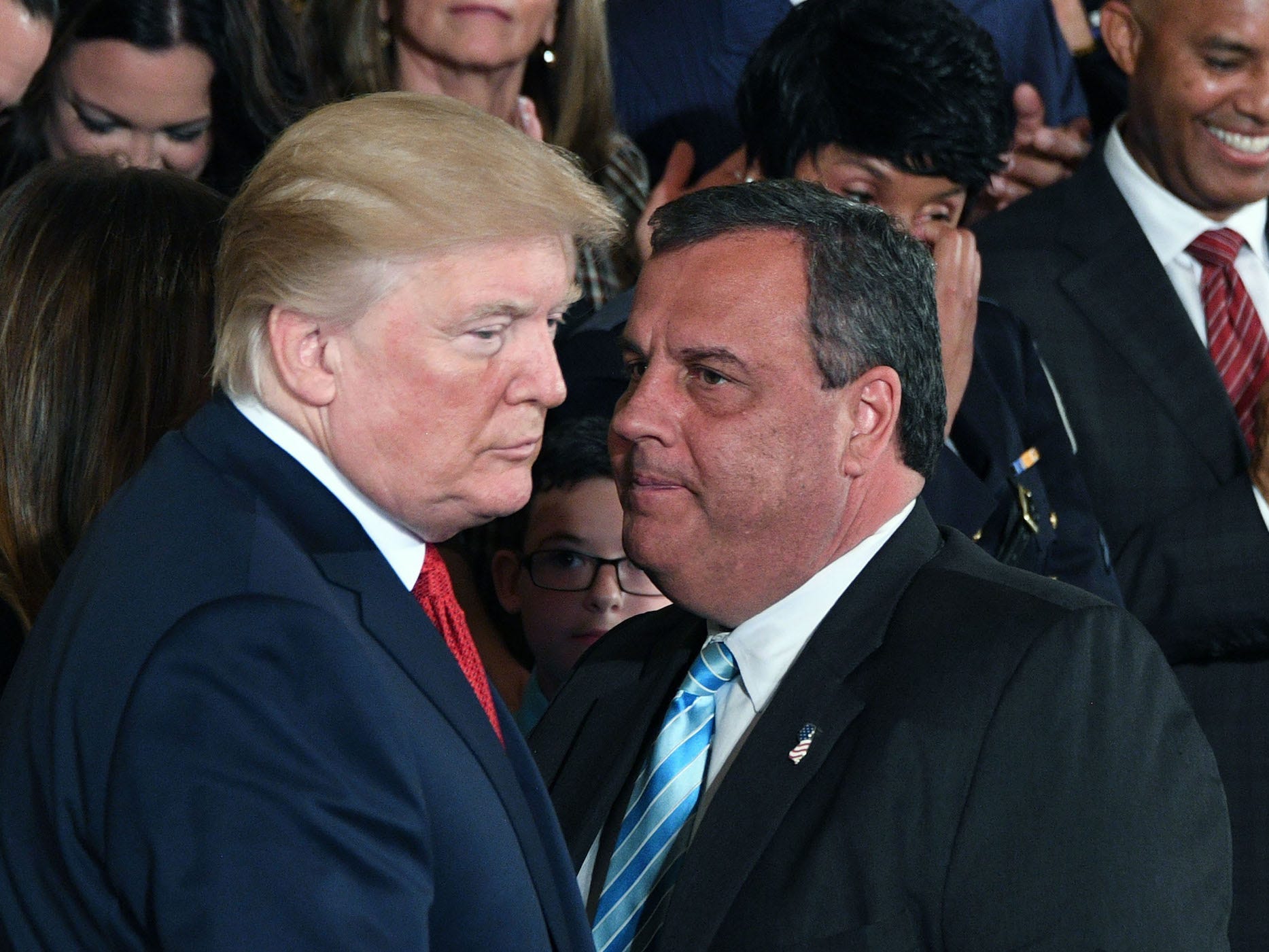 Former New Jersey Gov. Chris Christie speaks with former President Donald Trump at a White House event on October 26, 2017.
