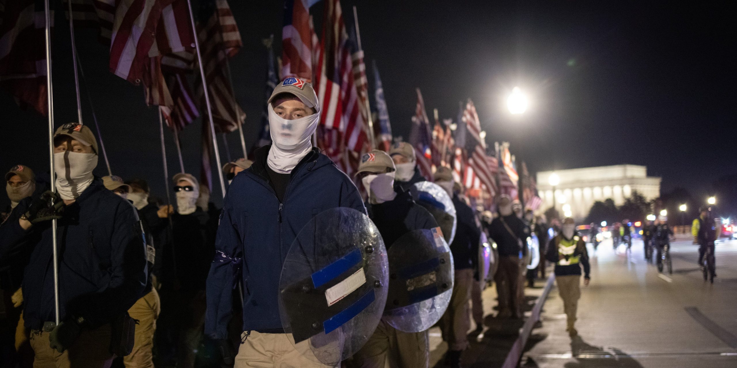 Members of the right-wing group Patriot Front march across Memorial Bridge in front of the Lincoln Memorial on December 04, 2021 in Washington, DC.