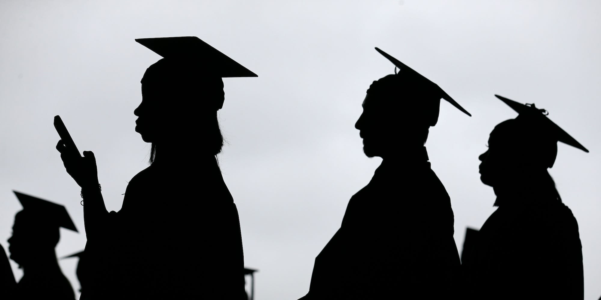 In this May 17, 2018, file photo, new graduates line up before the start of the Bergen Community College commencement at MetLife Stadium in East Rutherford, N.J. There’s no single policy or action that will alleviate America’s $1.74 trillion student loan debt crisis while simultaneously preventing students from taking on unaffordable amounts of future debt. Higher education financing experts are divided on the exact combination of solutions, but all agree it will require a multipronged approach.