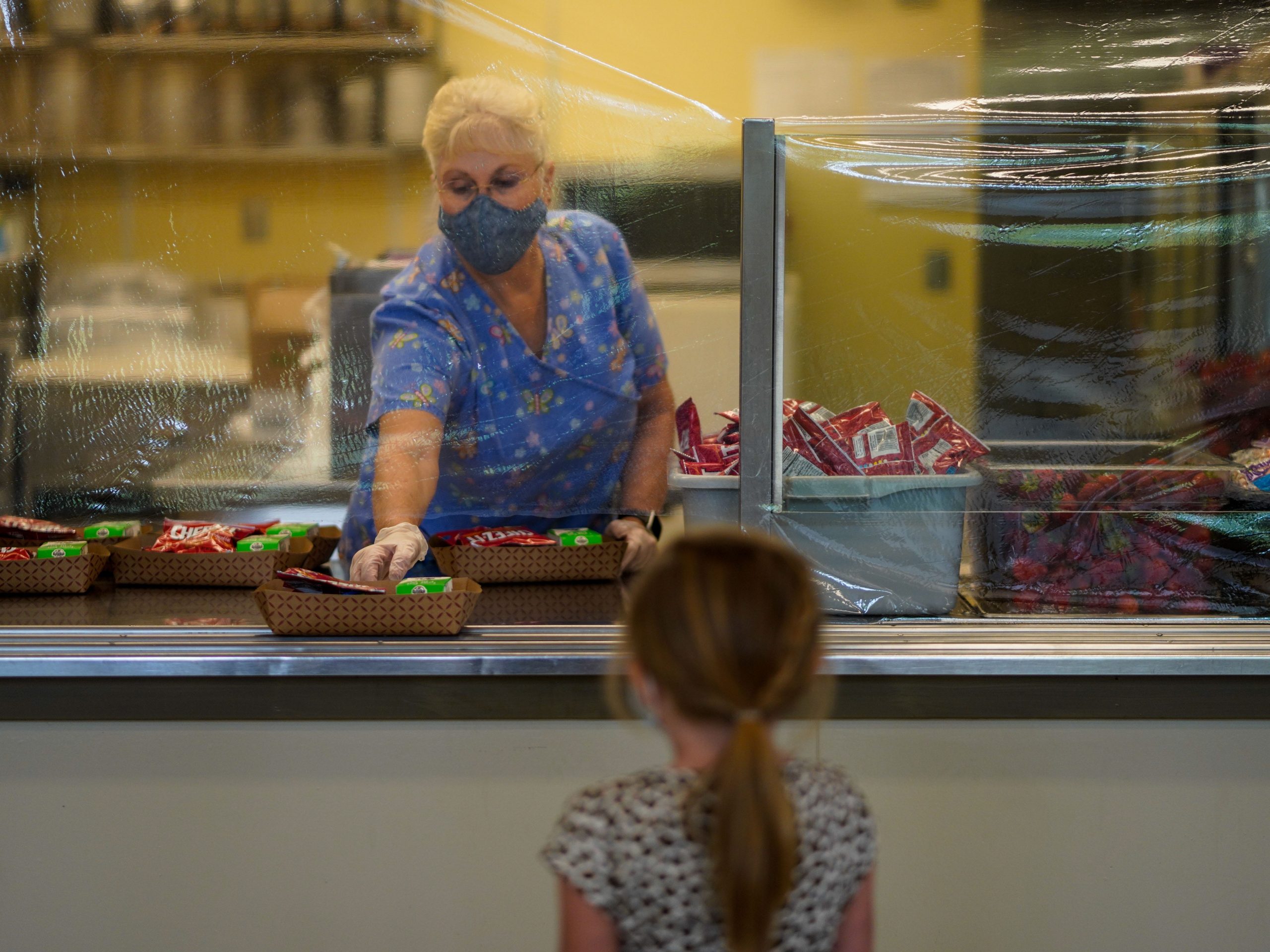 Cafeteria worker Kimberly Bigham passes out lunches at Weaverville Elementary.