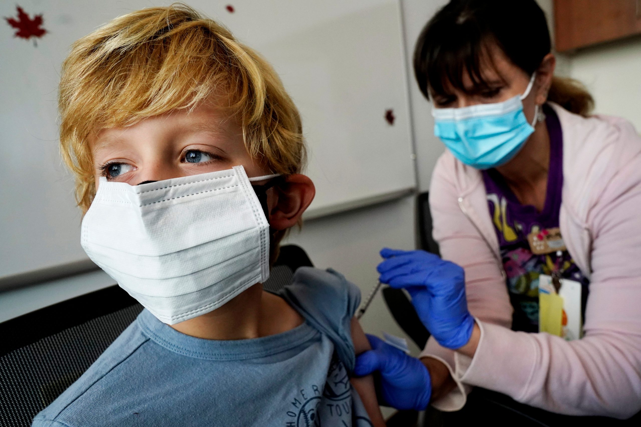 A young boy receives the COVID vaccine.