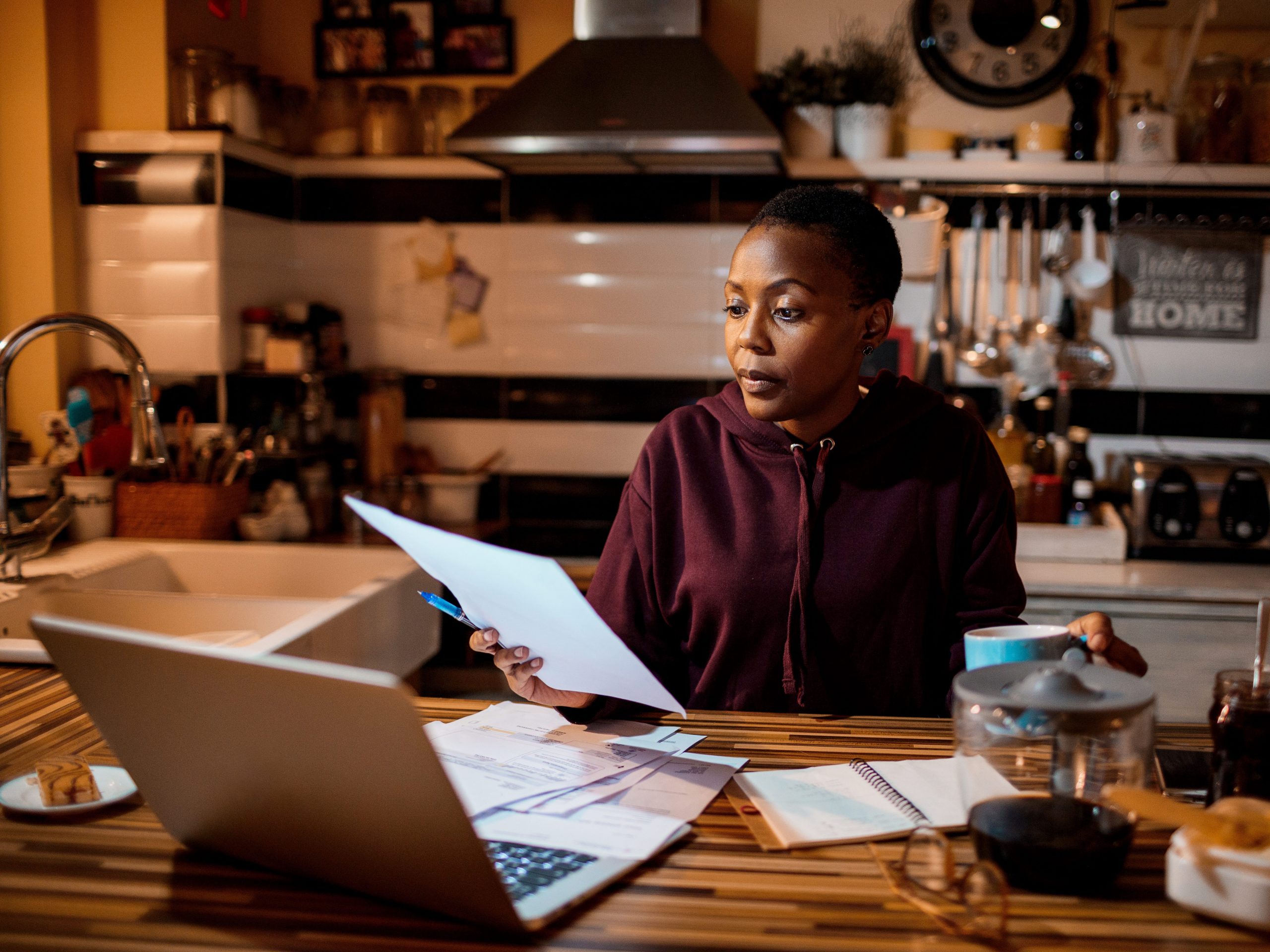 A person going over their finances at night.