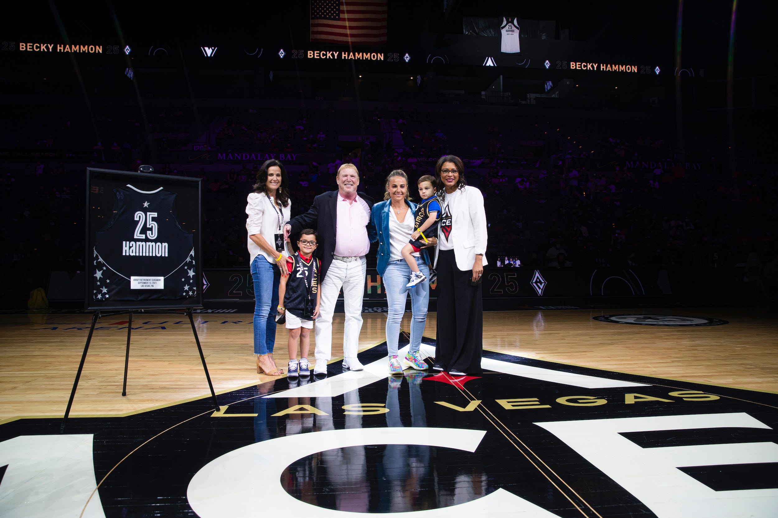 Becky Hammon poses next to Las Vegas Aces owner Mark Davis.