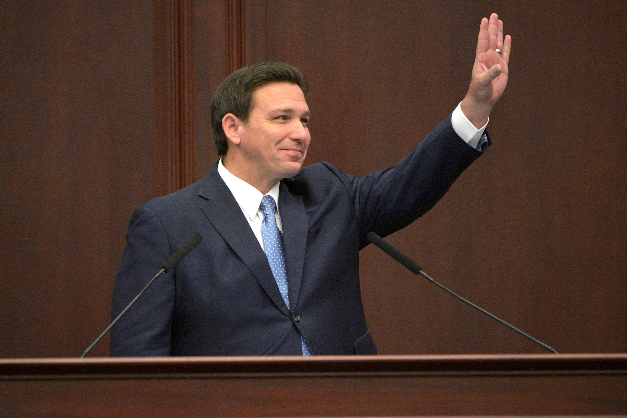 Gov. Ron DeSantis gestures during his annual address to state lawmakers in the Florida capitol of Tallahassee.