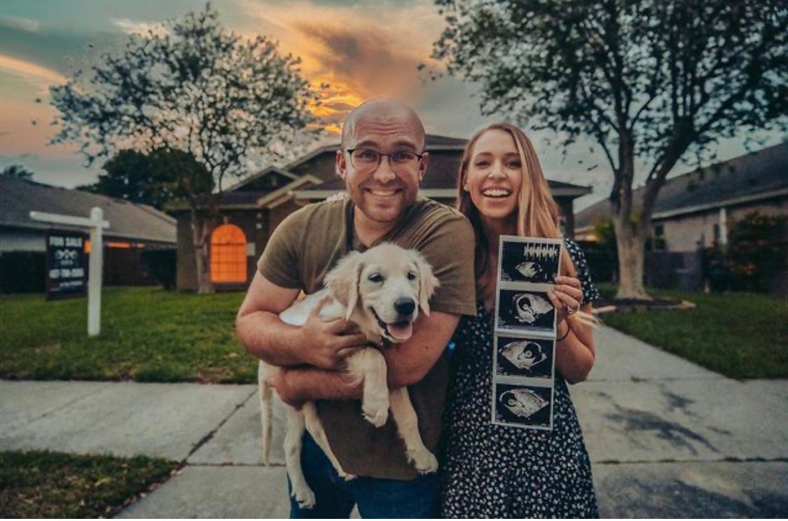 Jared and Monika Rohrer posing with their dog and photos of an ultrasound.