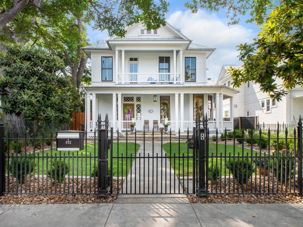 The outside of a white two-story house.