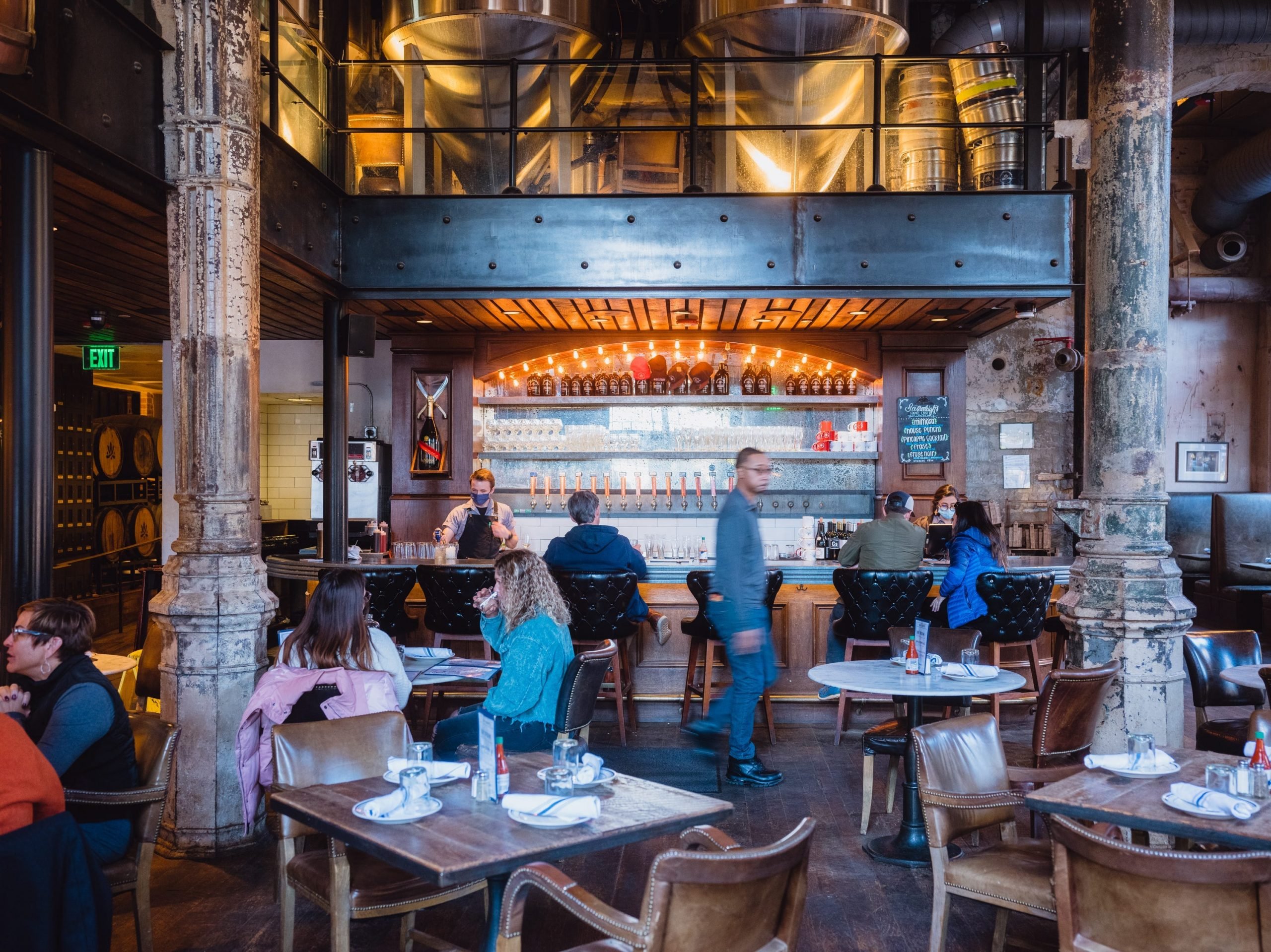 People milling about inside a restaurant.