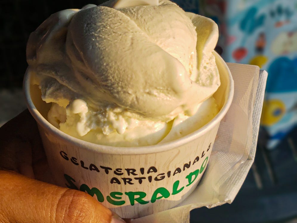 The writer holds a cup of gelato