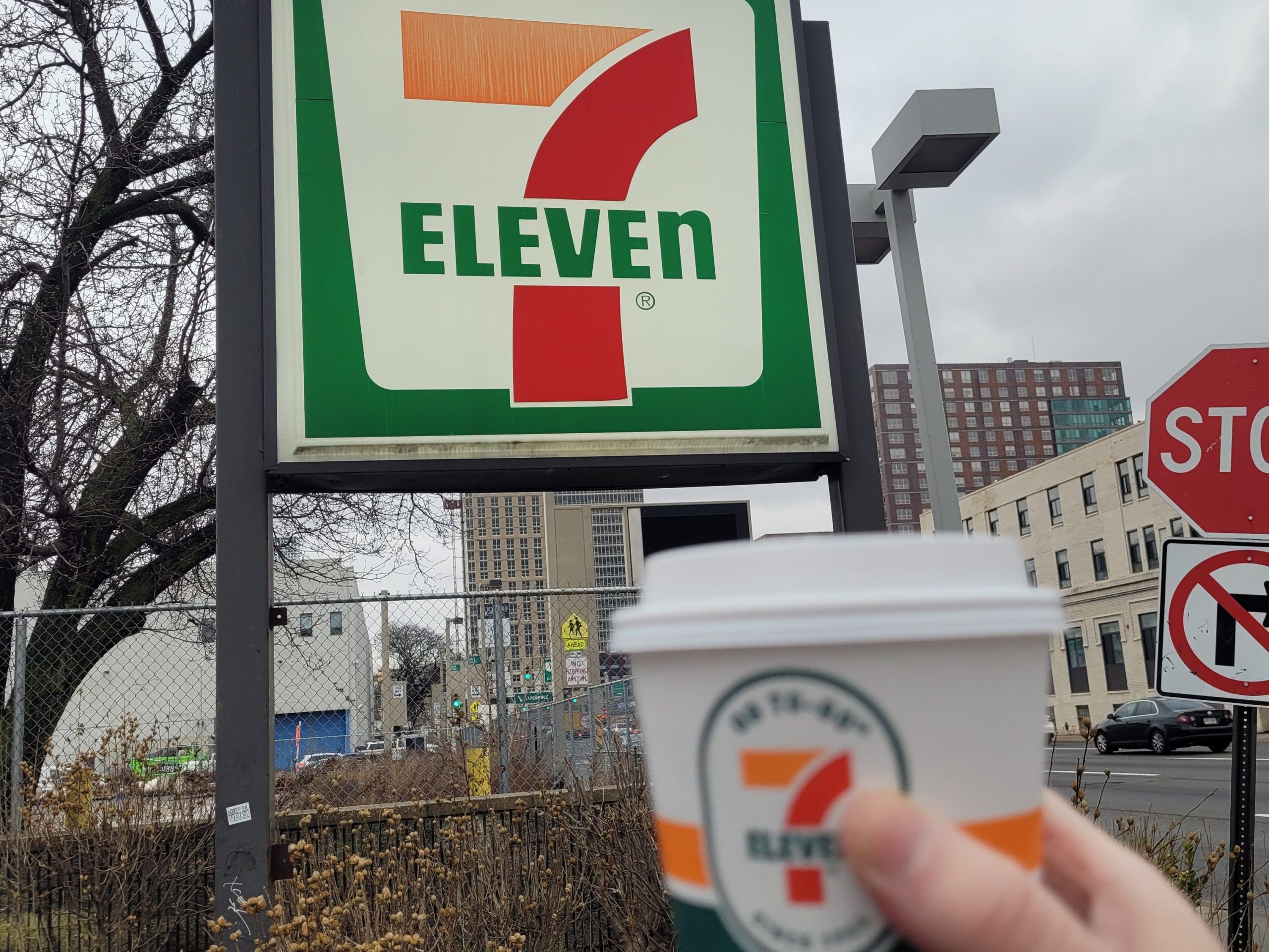 7-Eleven sign and cup of coffee