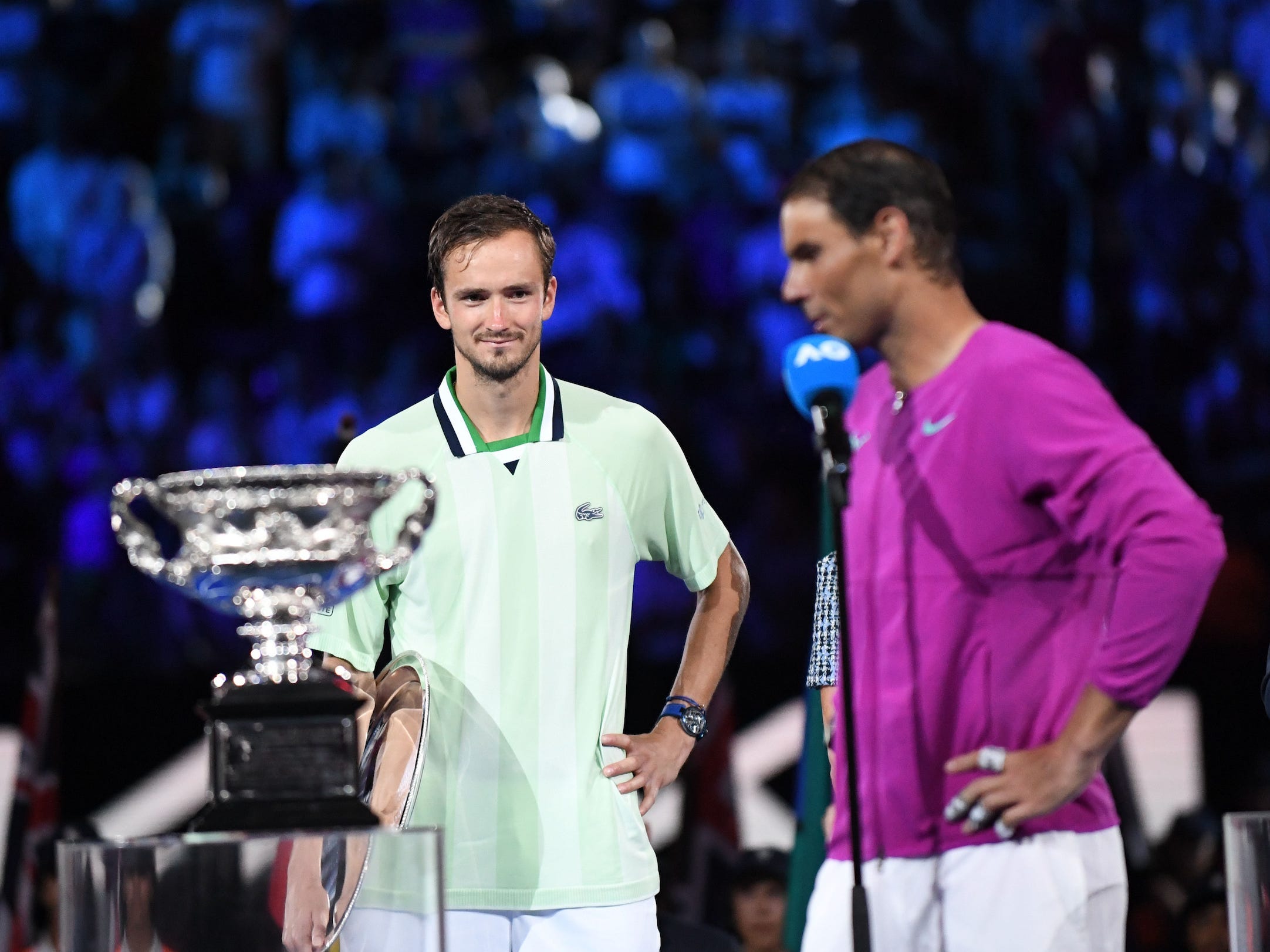 Daniil Medvedev (left) looks on as Rafael Nadal accepts his Australian Open trophy.