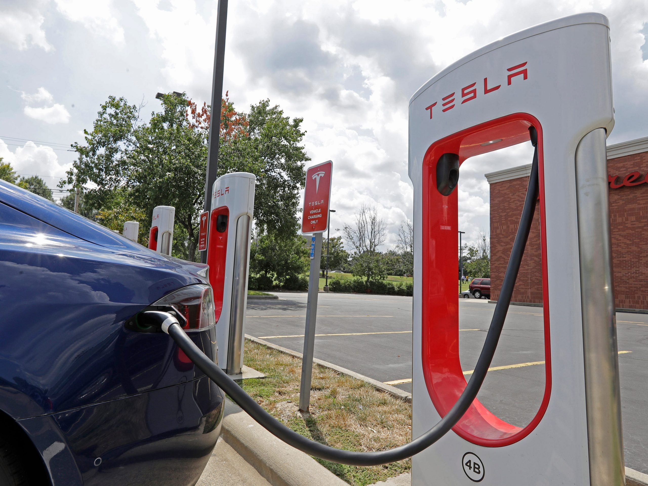 A Tesla at a Supercharger