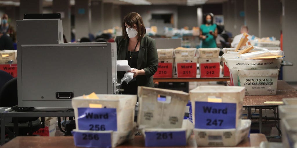 Claire Woodall-Vogg, executive director of the Milwaukee election commission collects the count from absentee ballots from a voting machine on November 04, 2020 in Milwaukee, Wisconsin.