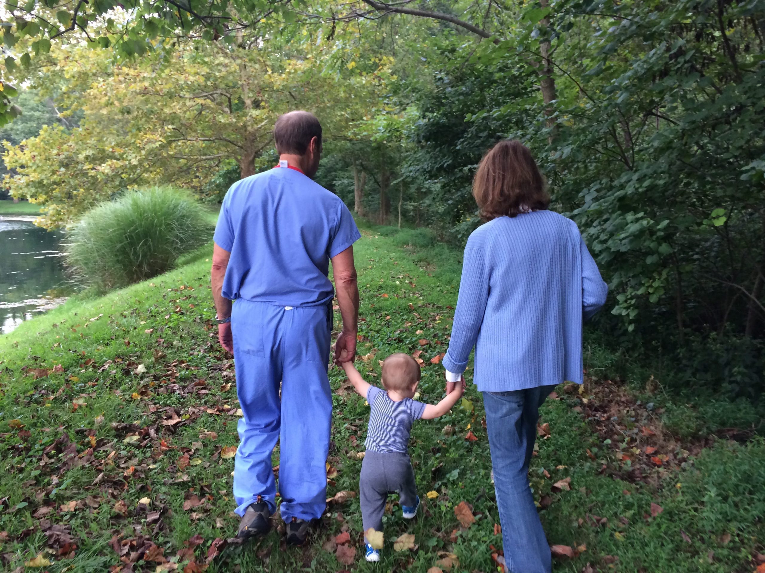 Boy and his grandparents walking