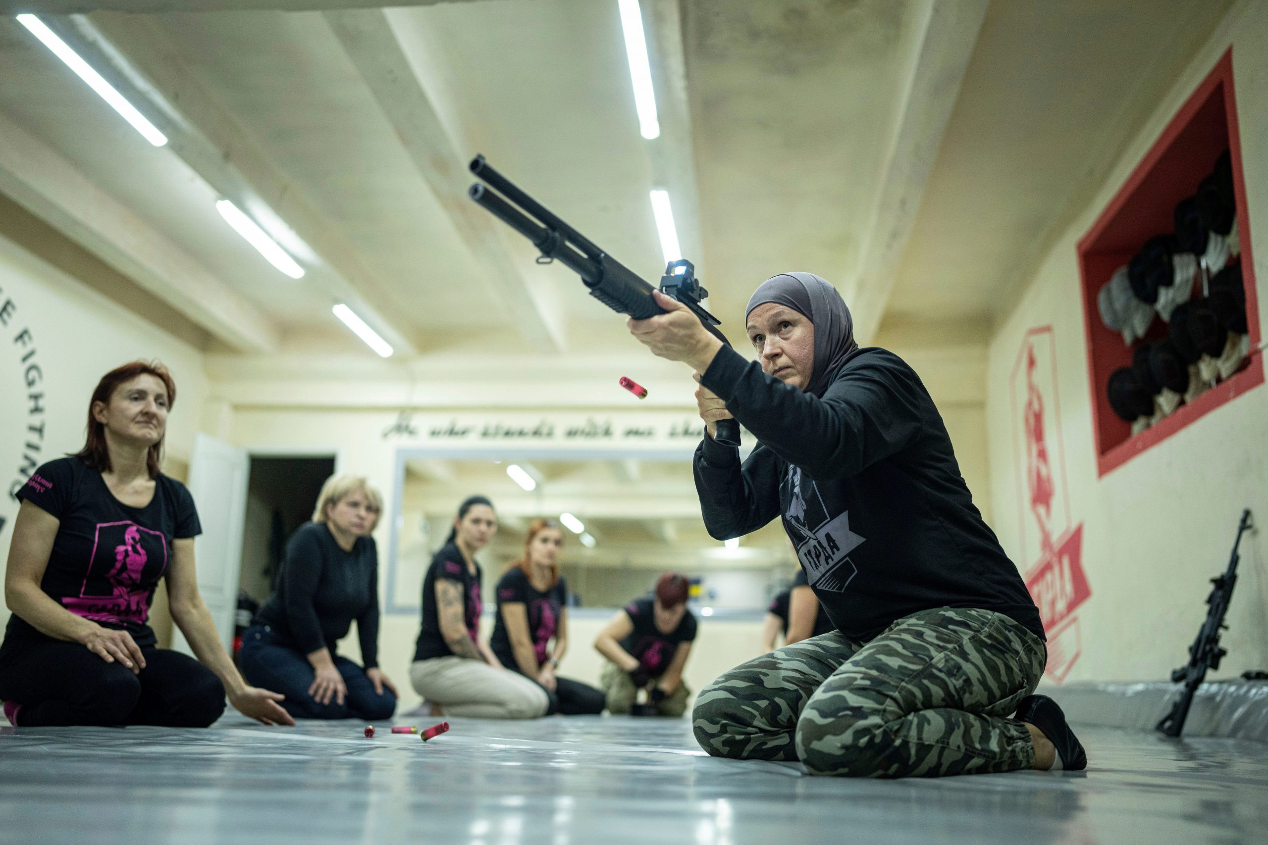 Svetlana Putilina trains to use a gun in Kharkiv, Ukraine, Sunday, Jan. 30, 2022.