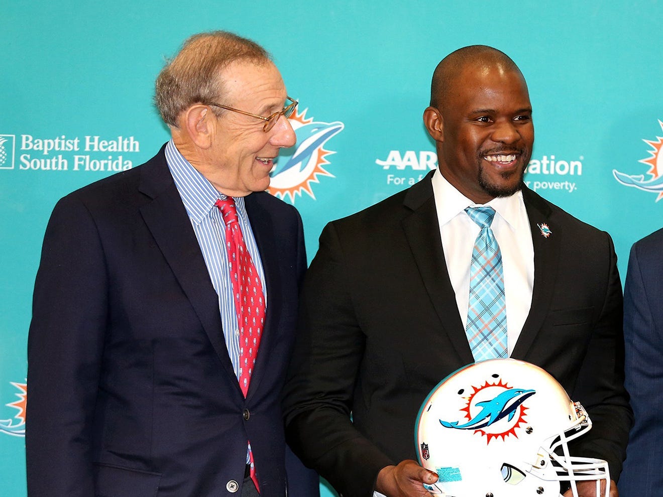 Brian Flores is introduced as head coach of the Miami Dolphins alongside owner Stephen Ross in 2019.