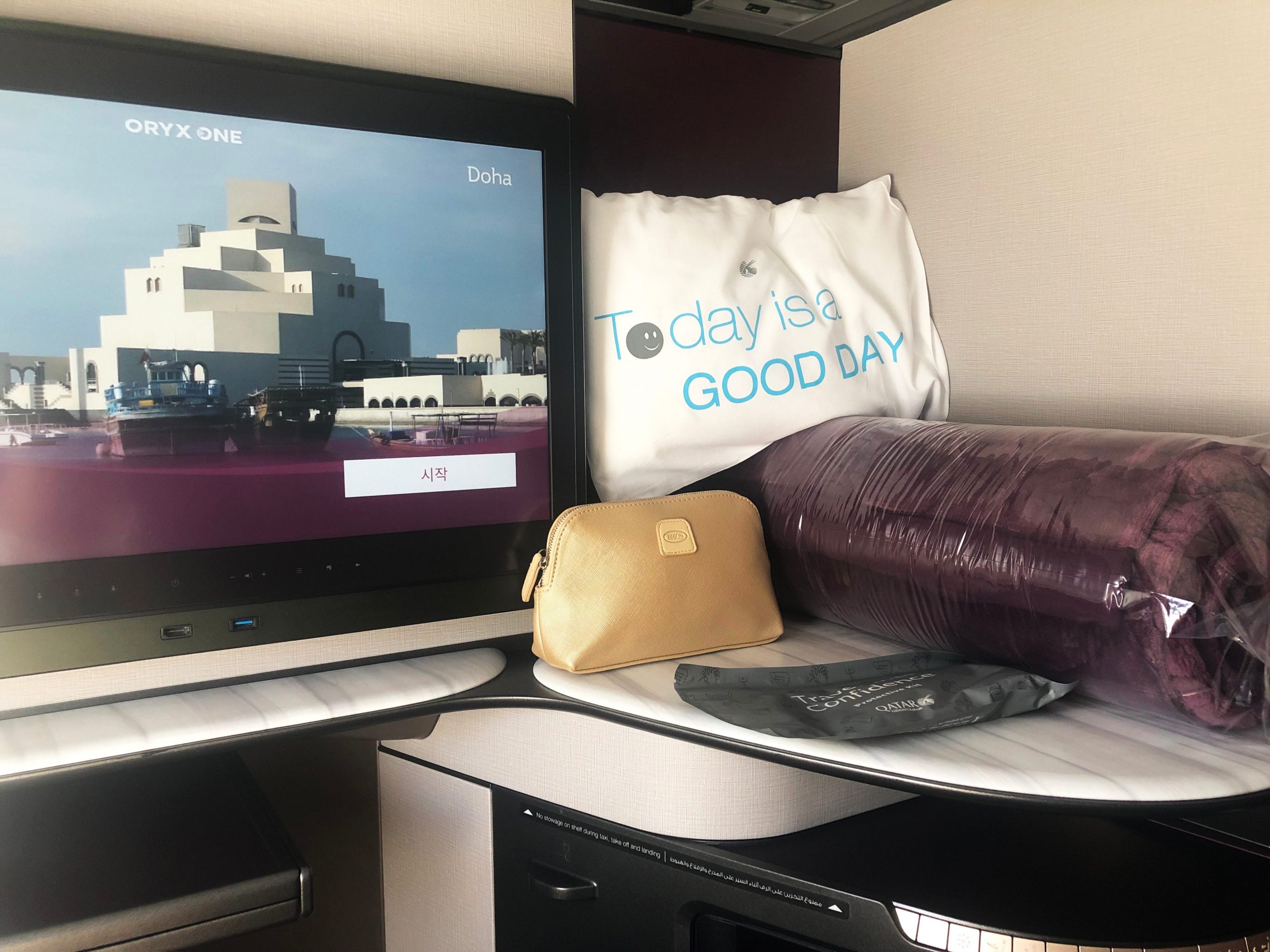TV, pillow, amenities on airplane