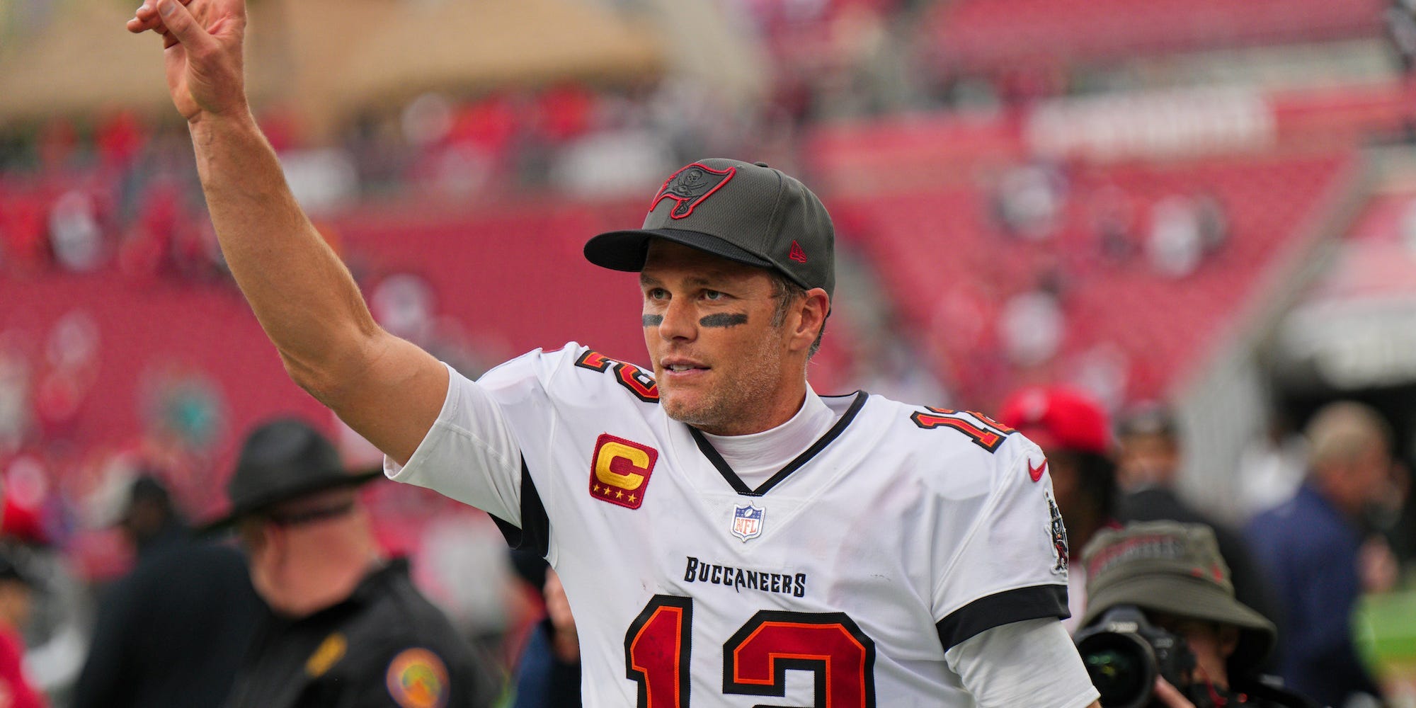 Tom Brady waves after a game in 2022.