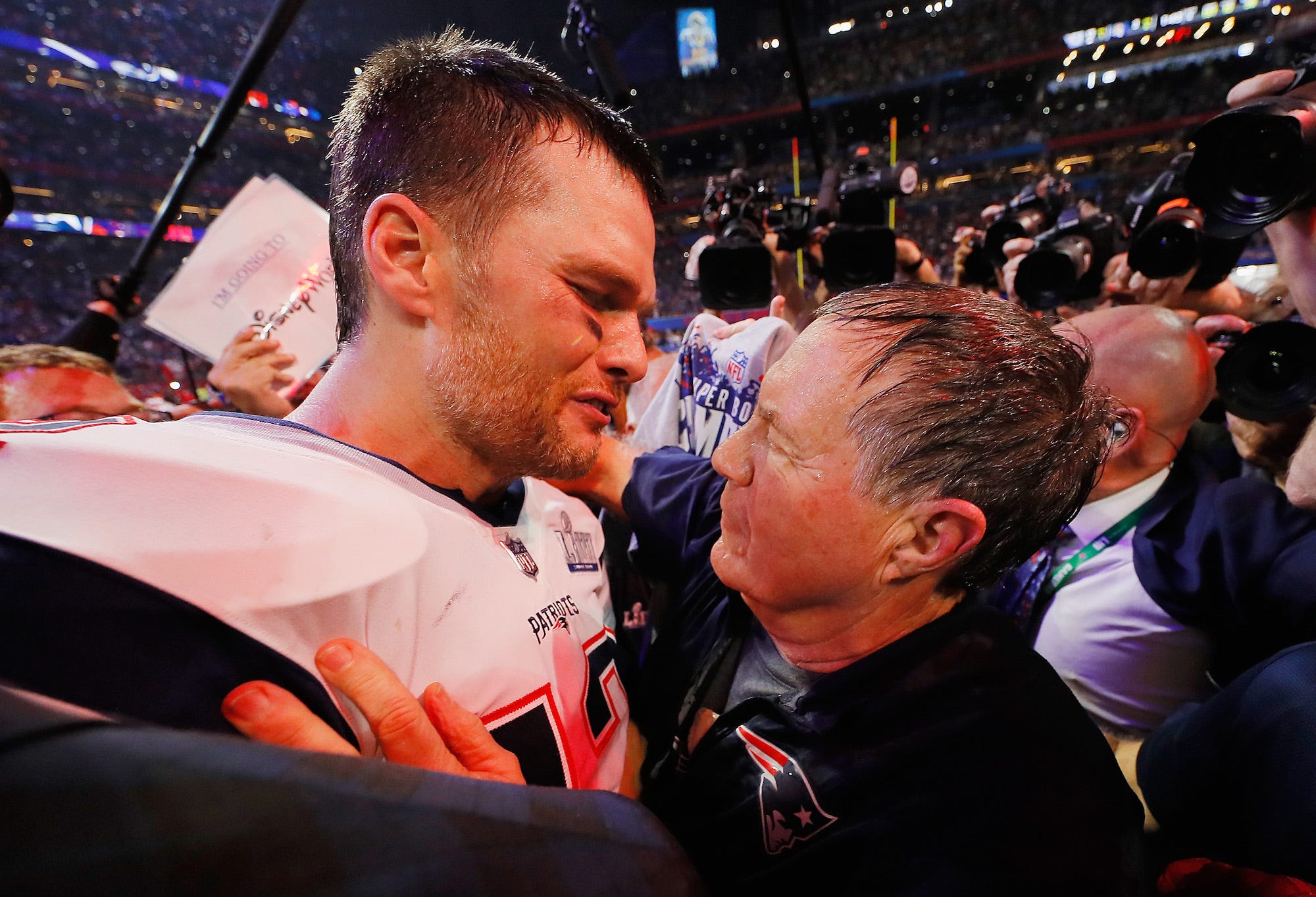 Tom Brady #12 of the New England Patriots talks to head coach Bill Belichick of the New England Patriots after the Patriots defeat the Rams 13-3 during Super Bowl LIII at Mercedes-Benz Stadium