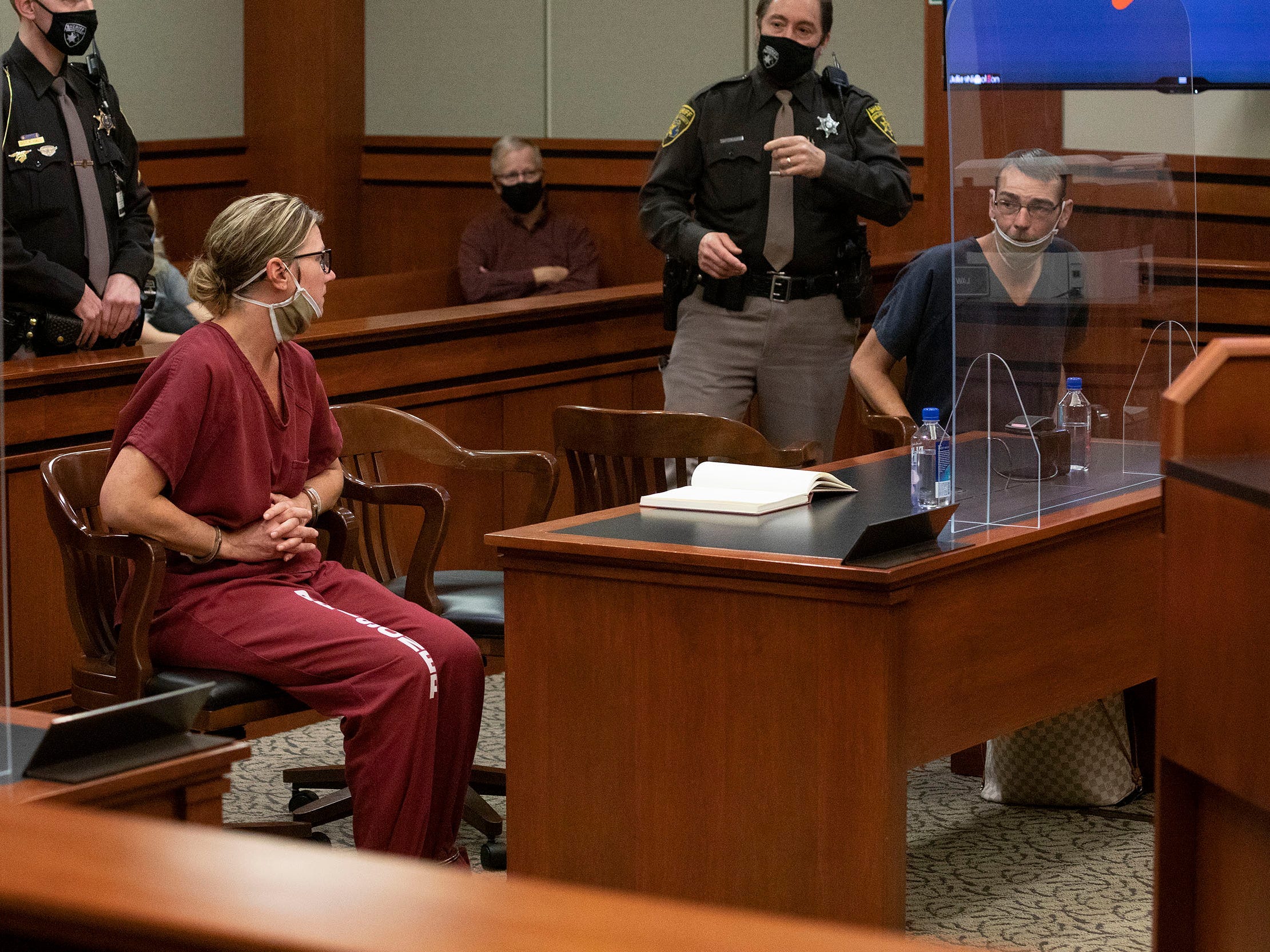 James Crumbley and Jennifer Crumbley appear in a Michigan court for December 14 hearing in the case of the Oxford High School mass shooting.