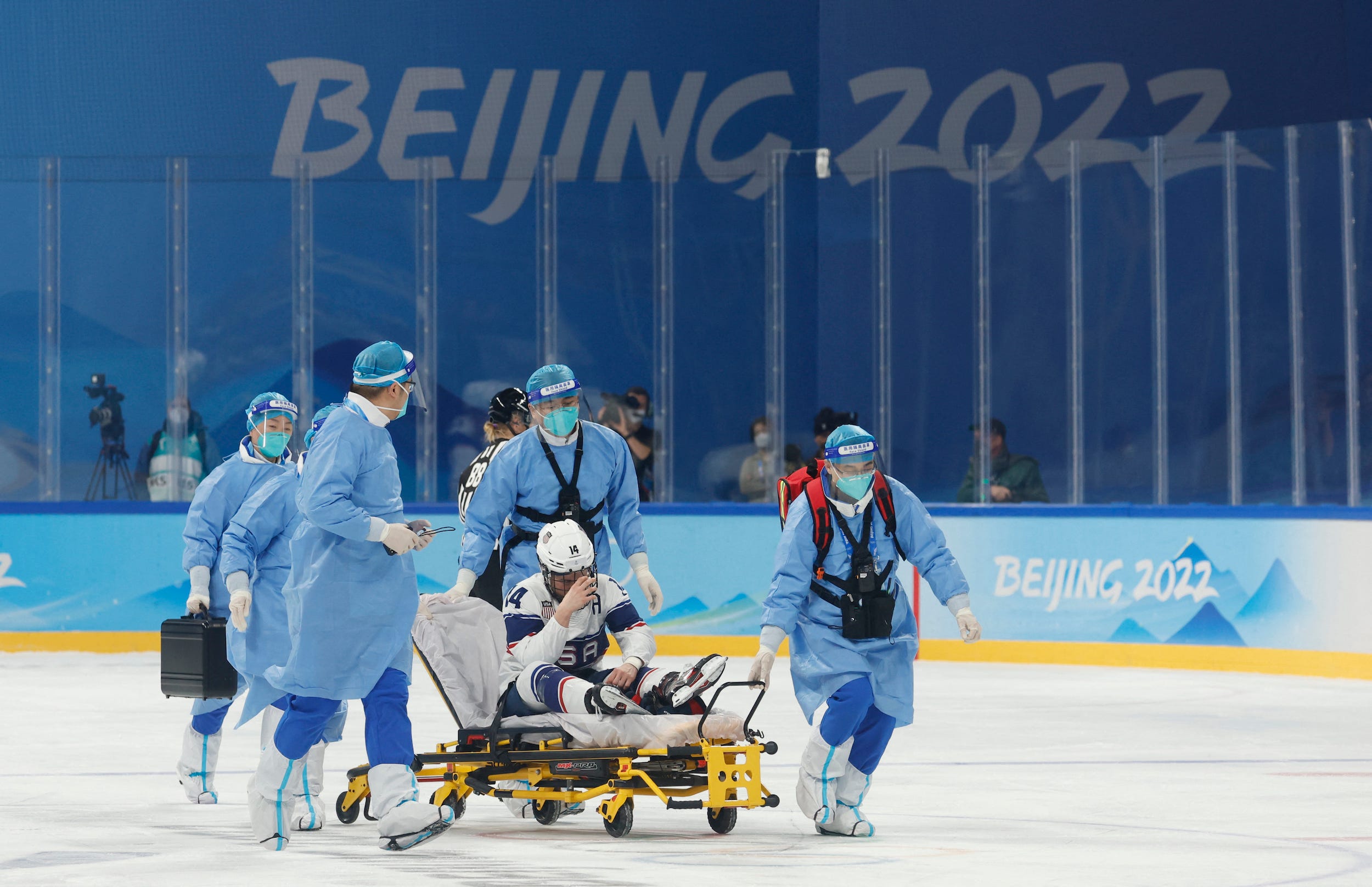 Brianna Decker is stretchered off the ice during the first period of Team USA's inaugural game at the 2022 Beijing Olympics.