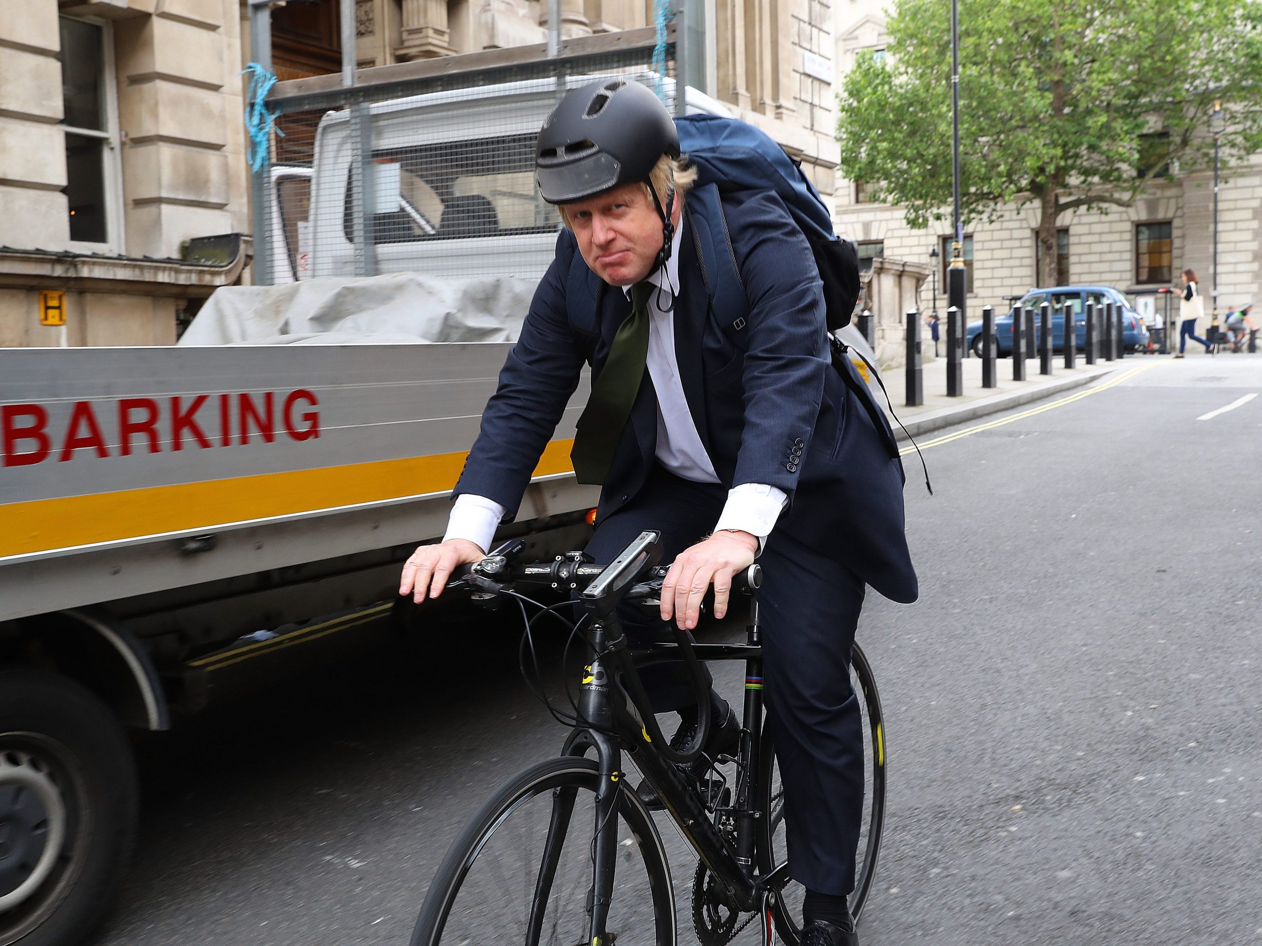 Boris Johnson riding a bicycle