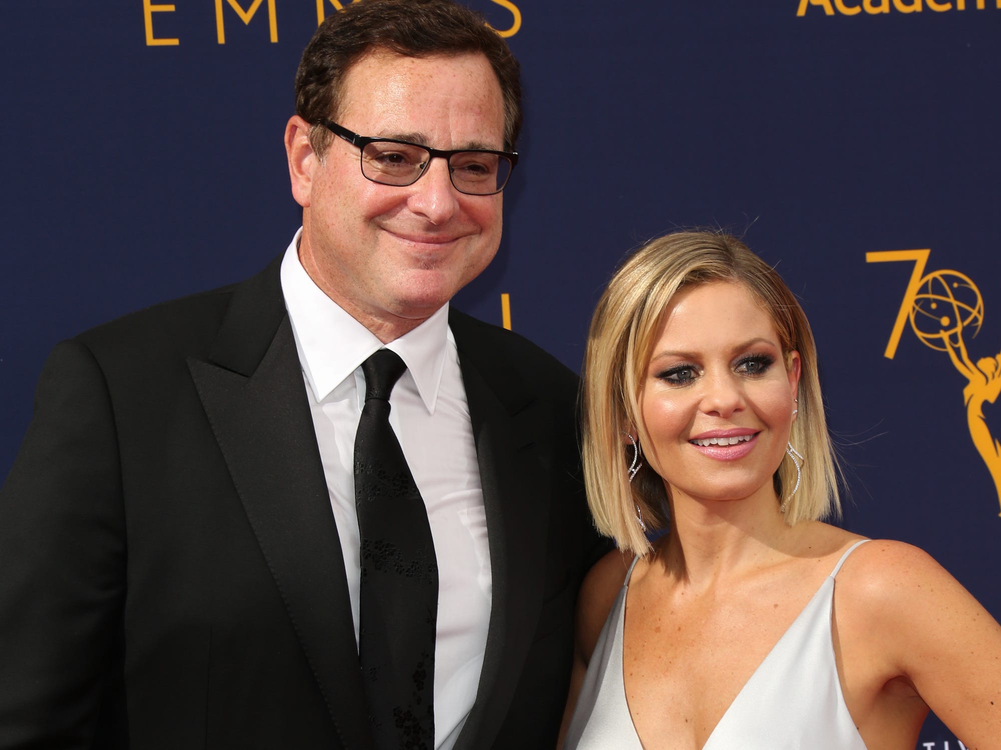 Actors Bob Saget (L) and Candace Cameron Bure (R) attend the 2018 Creative Arts Emmy Awards at Microsoft Theater on September 8, 2018 in Los Angeles, California.