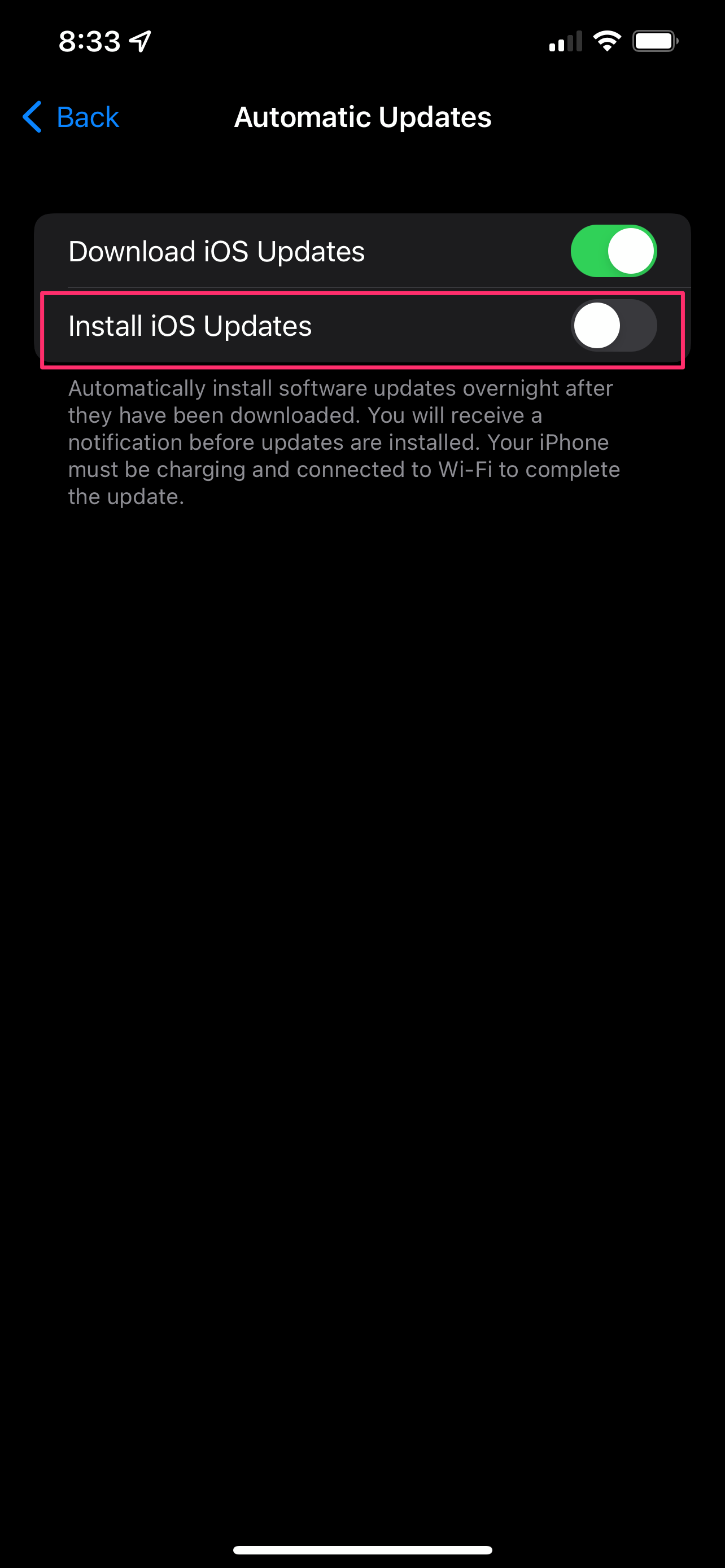 Turn off the iOS Updates toggle in order to stop the automatic installation of updates.