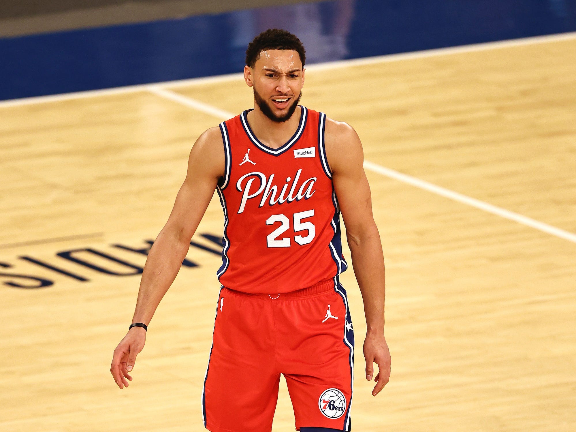 Ben Simmons frowns while on the court during a game in 2021.