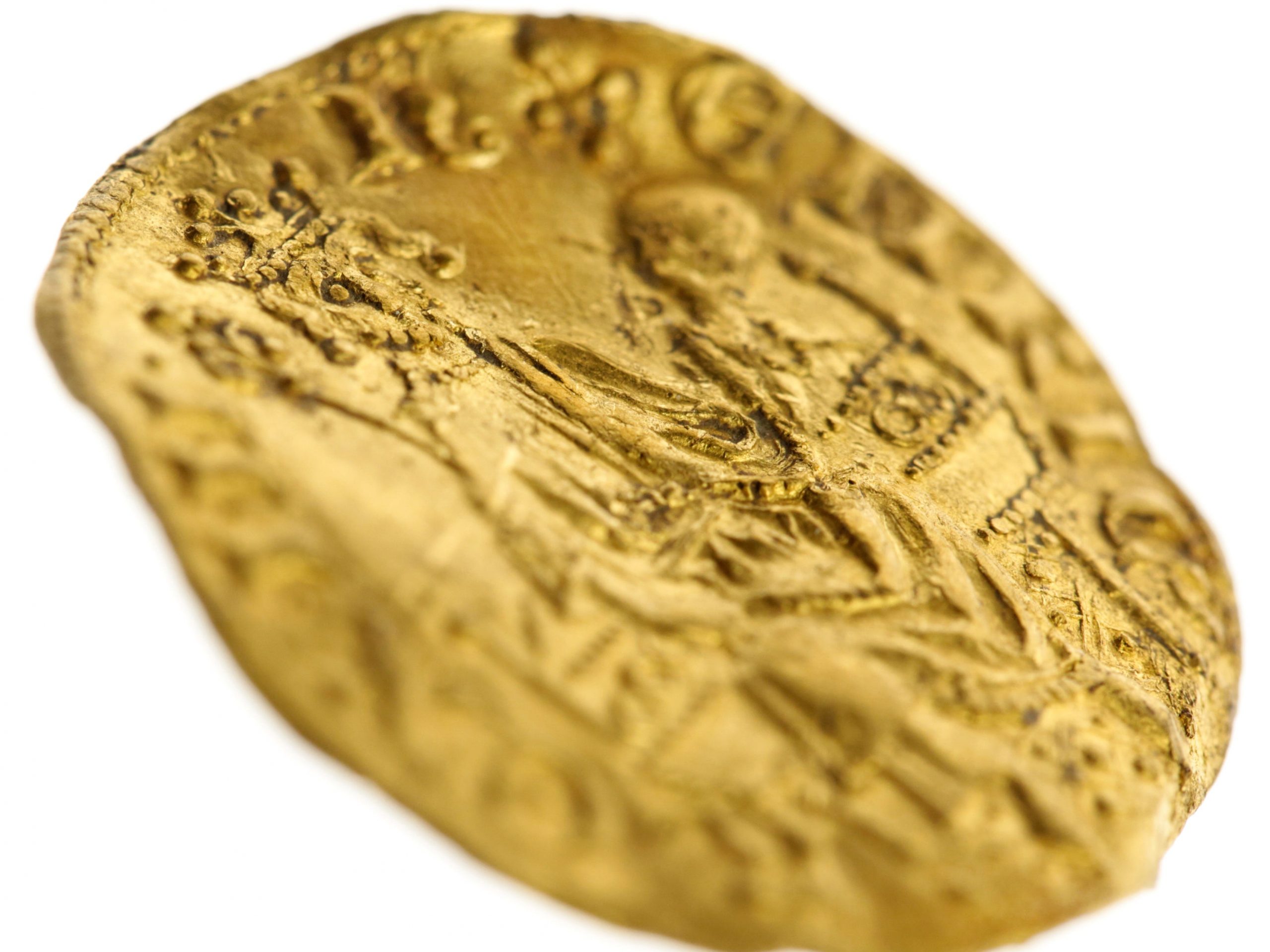 The gold coin found by the father of two, which dates back to the thirteen century.