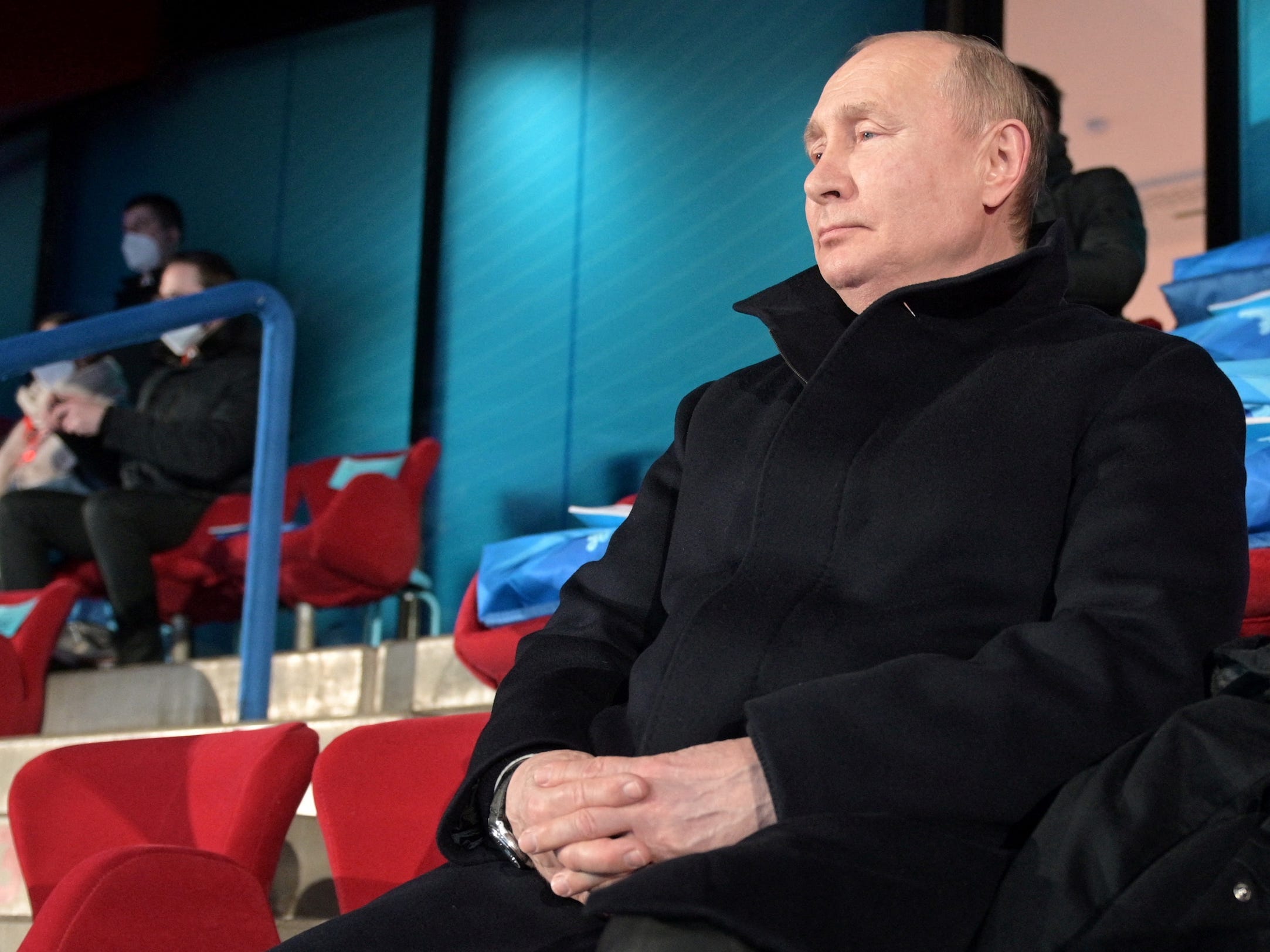 Vladimir Putin watches the opening ceremony at the Beijing Olympics.
