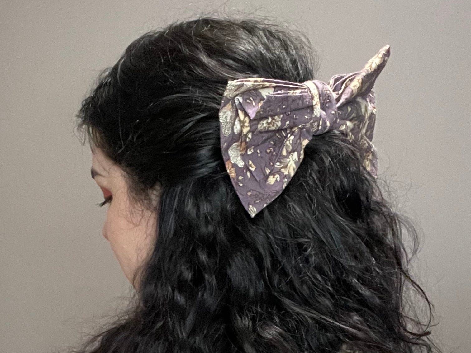 The writer with purple bow in hair