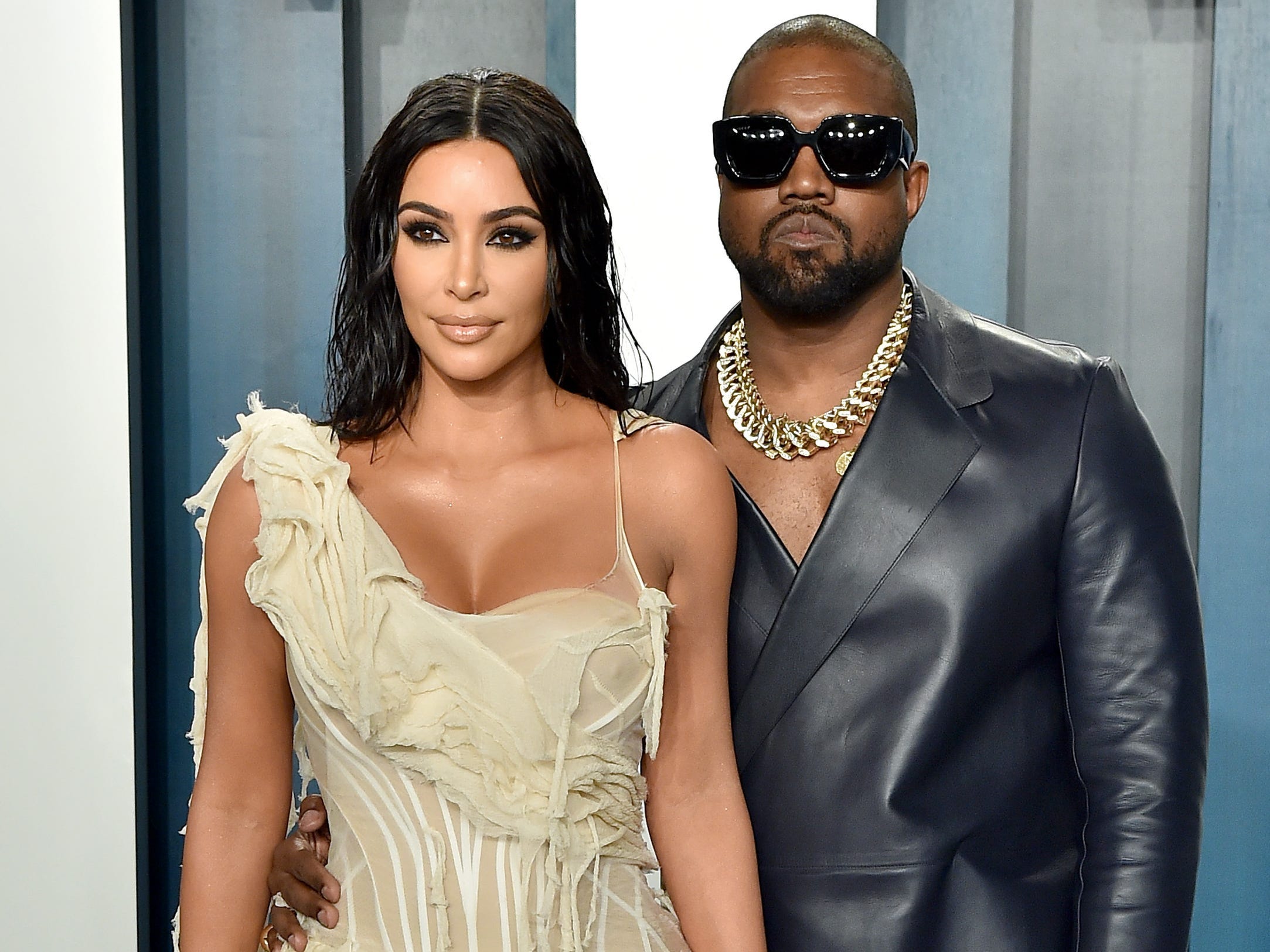 Kim Kardashian and Kanye West posing together.