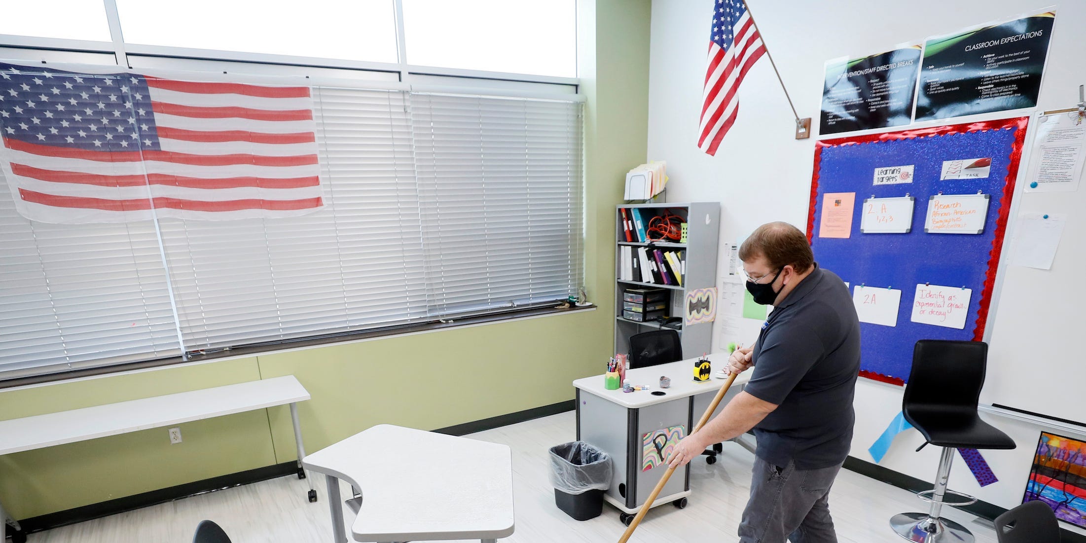 A custodian cleans a Des Moines classroom in 2020