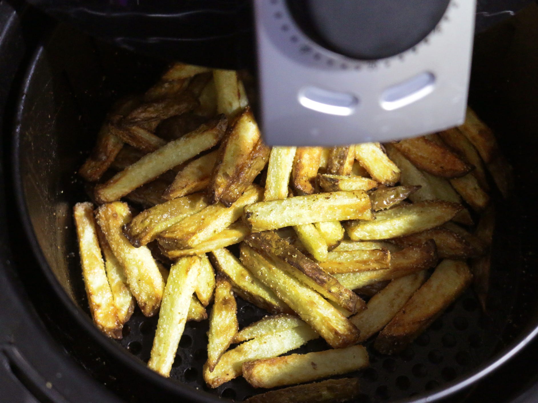 French fries in an air fryer.