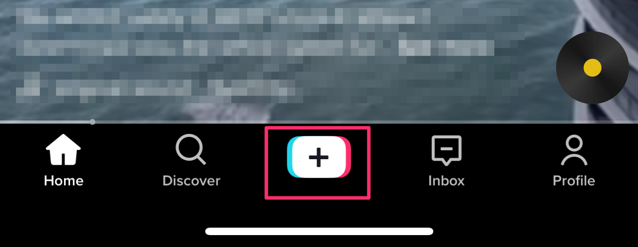 Tap the button located in the bottom-middle of the screen.