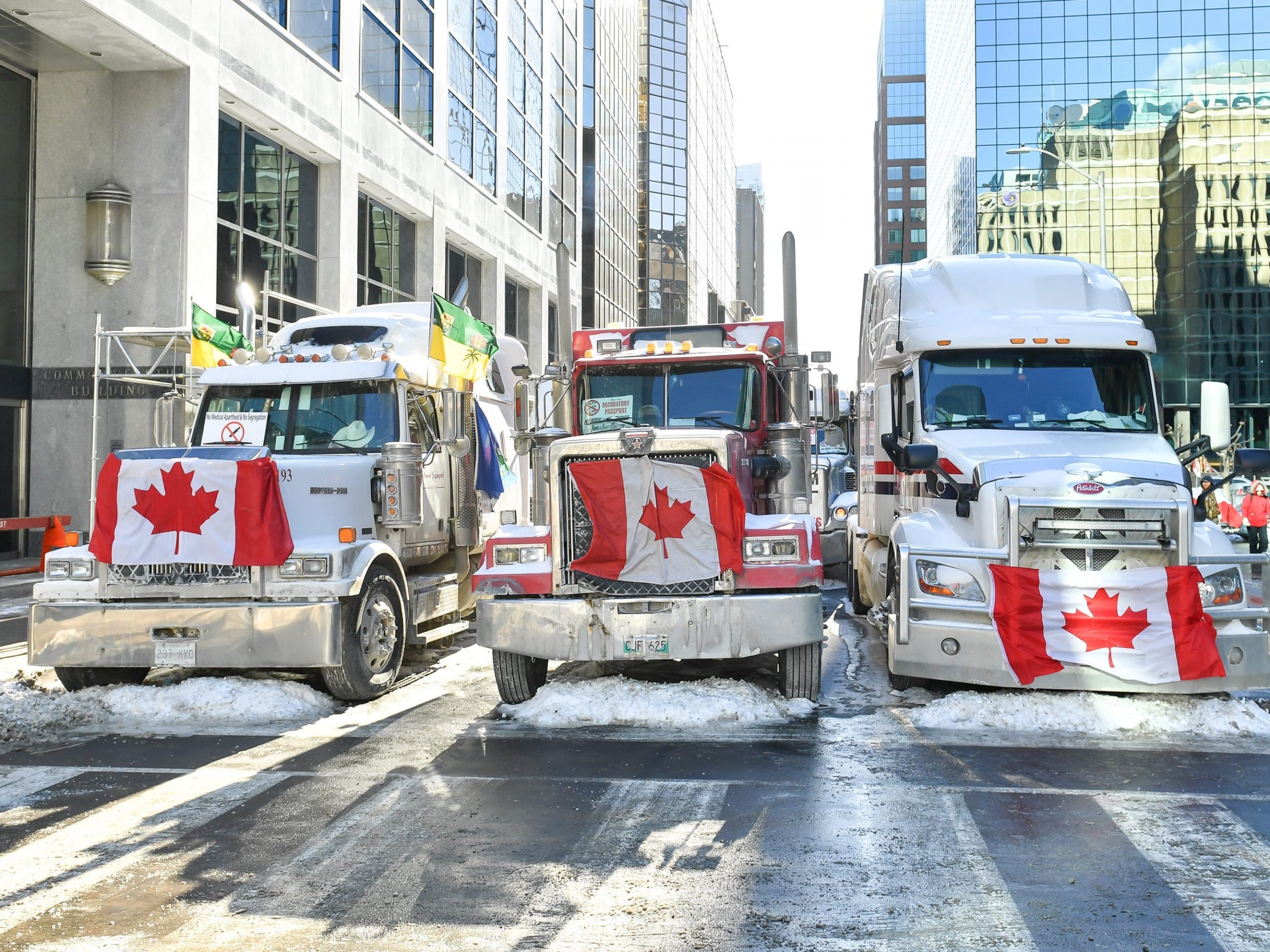 Truckers lineup their trucks on Metcalfe Street as they honk their horns on February 5, 2022 in Ottawa, Canada.