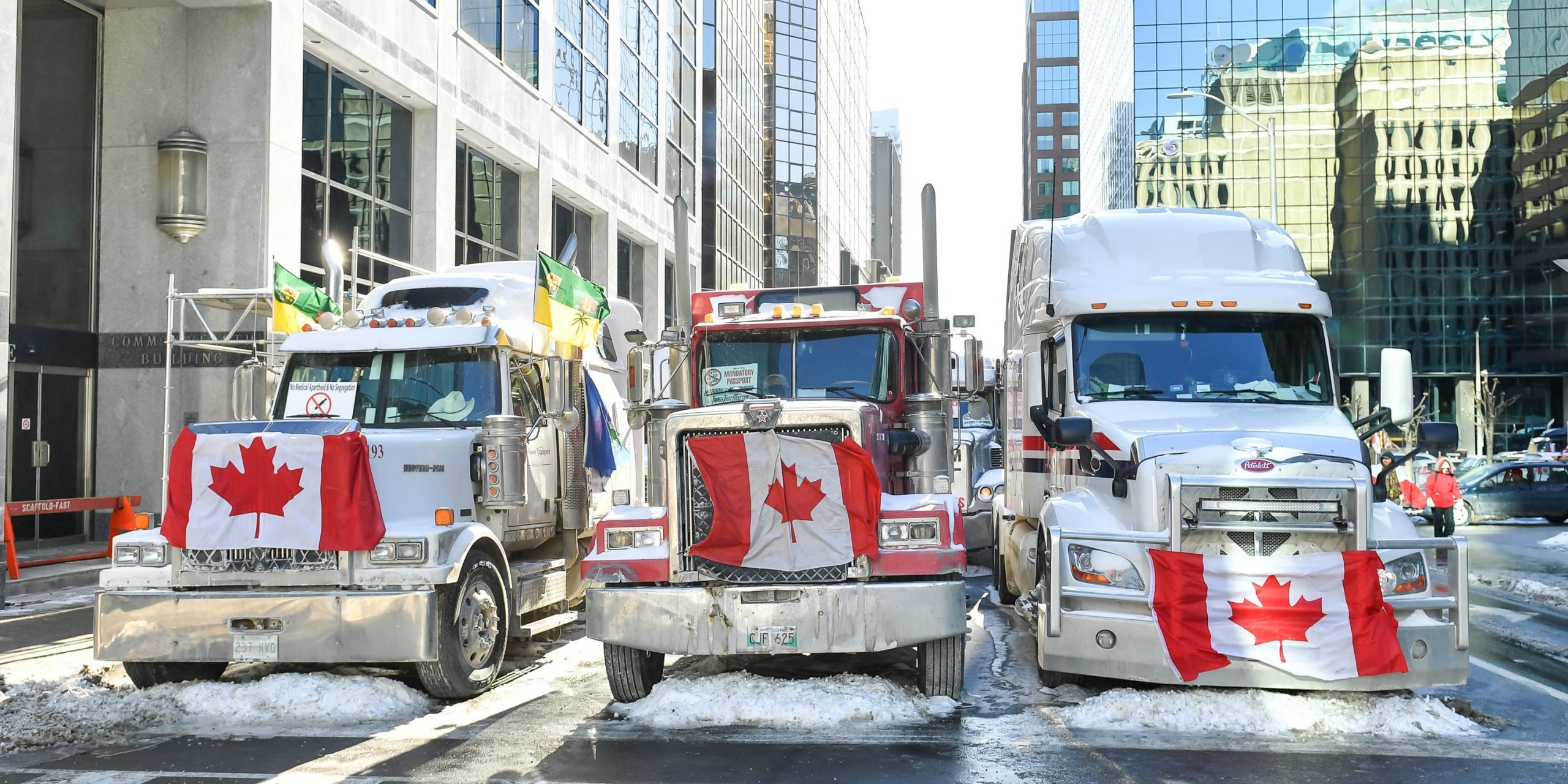 Truckers lineup their trucks on Metcalfe Street as they honk their horns on February 5, 2022 in Ottawa, Canada.