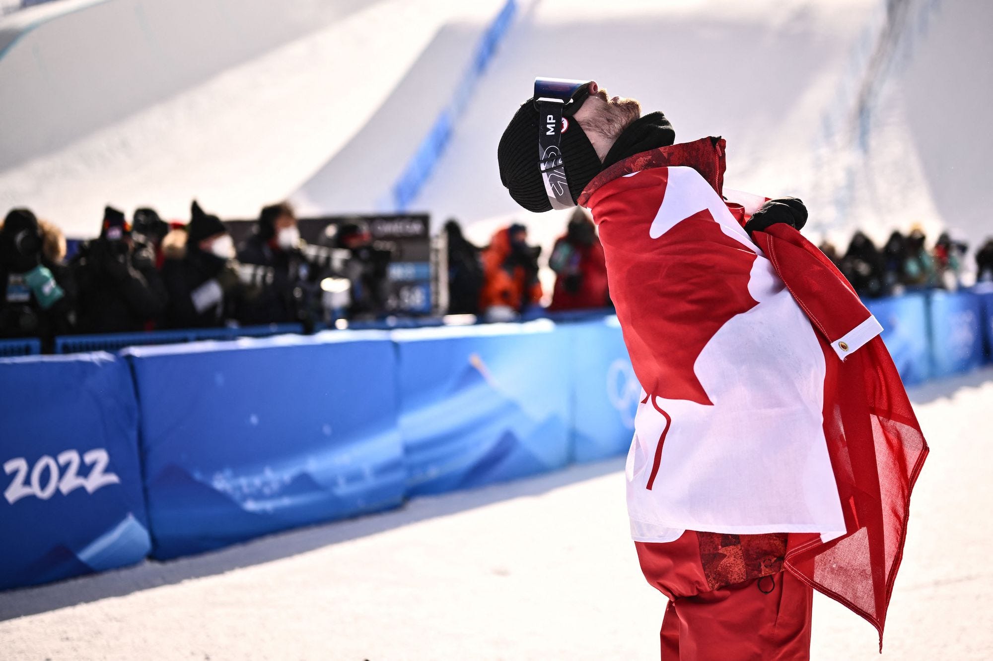 Gold medal winner Max Parrot of Canada on the podium after his victory in the Snowboard Slopestyle Final for Men at Genting Snow Park during the Winter Olympic Games