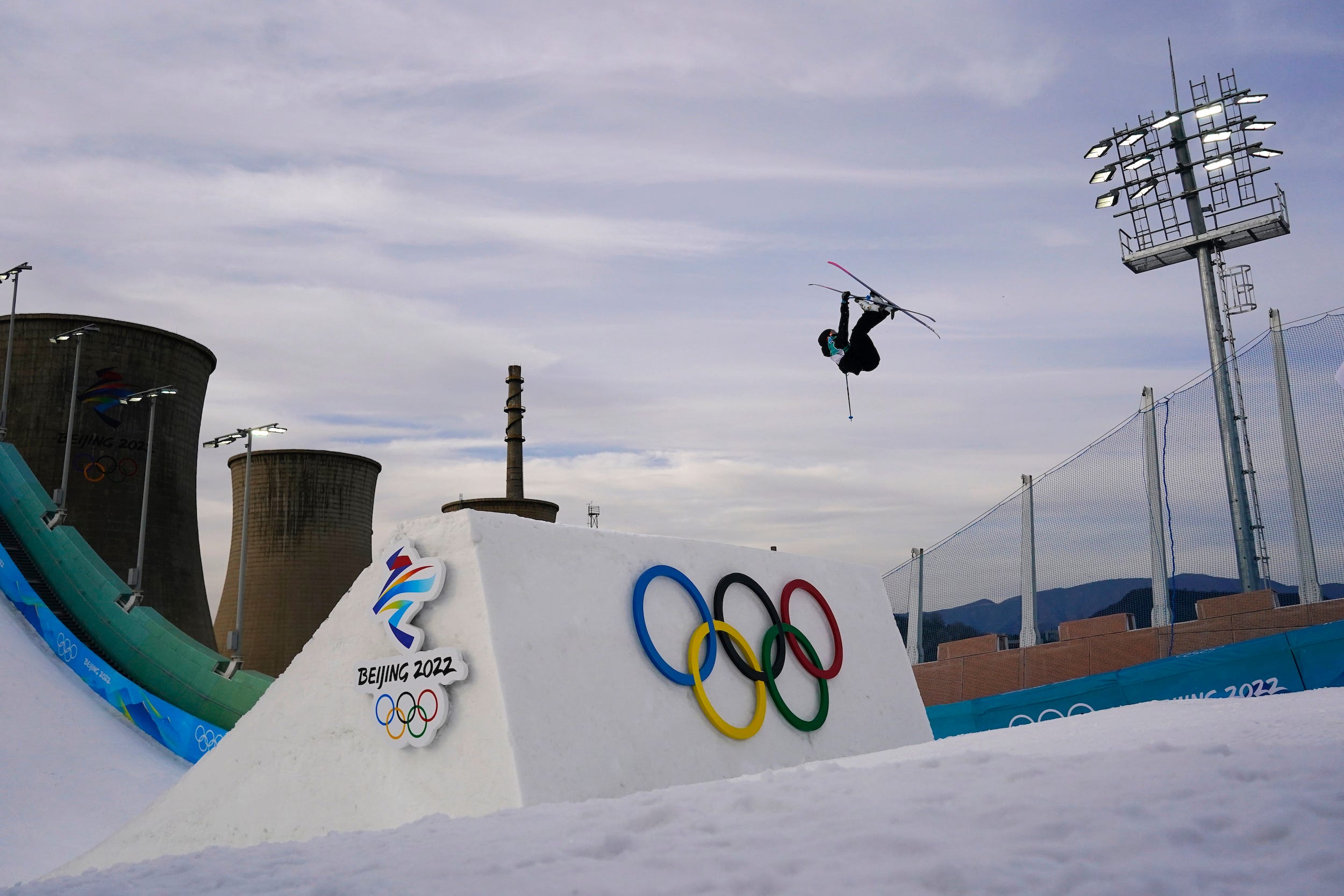 Swiss skier Kim Gubser loses his wallet mid-flip during the men's freestyle skiing big air qualification round of the 2022 Winter Olympics in Beijing.