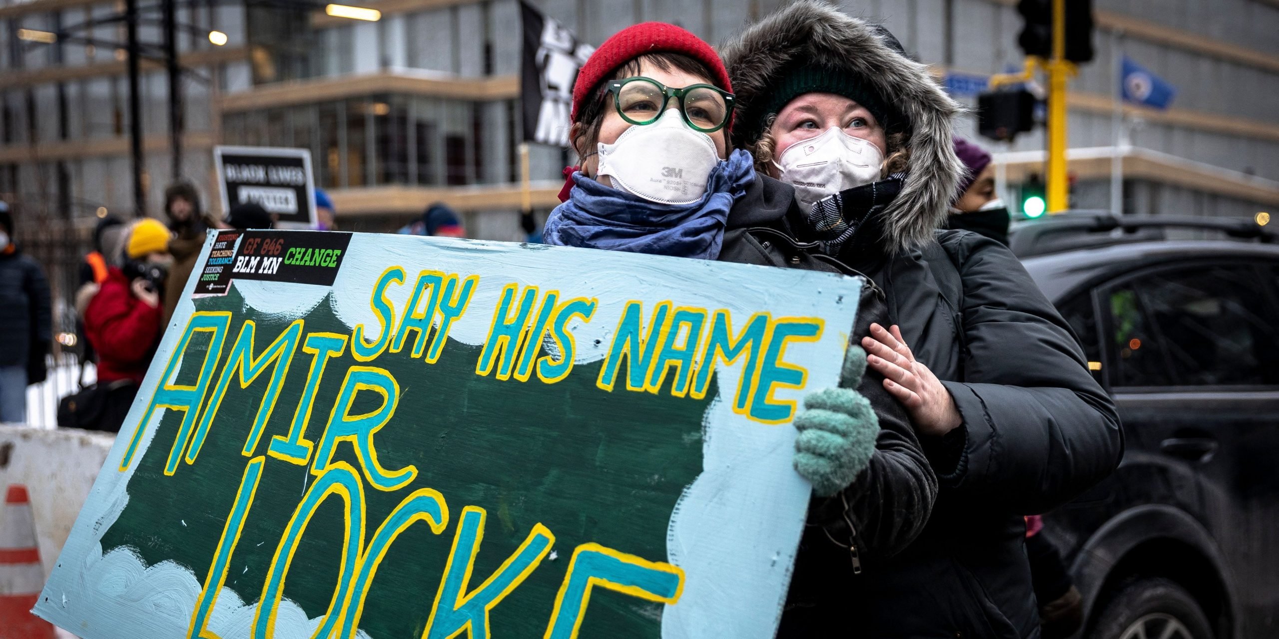 Demonstrators hold a "Say His Name" sign during a rally in protest of the killing of Amir Locke, outside the Police precint in Minneapolis, Minnesota on February 5, 2022