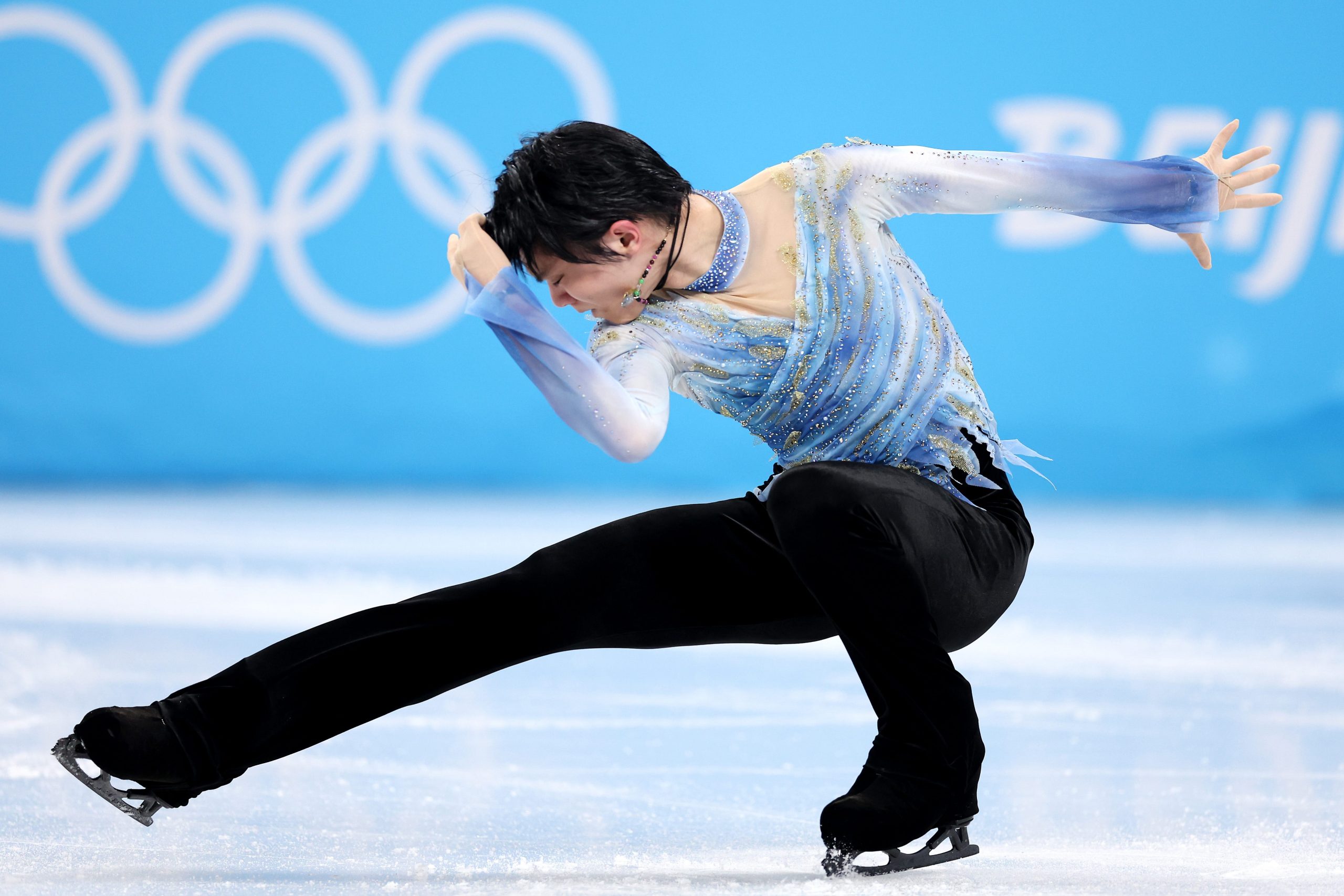 Yuzuru Hanyu competes in the men's singles figure skating in Beijing.