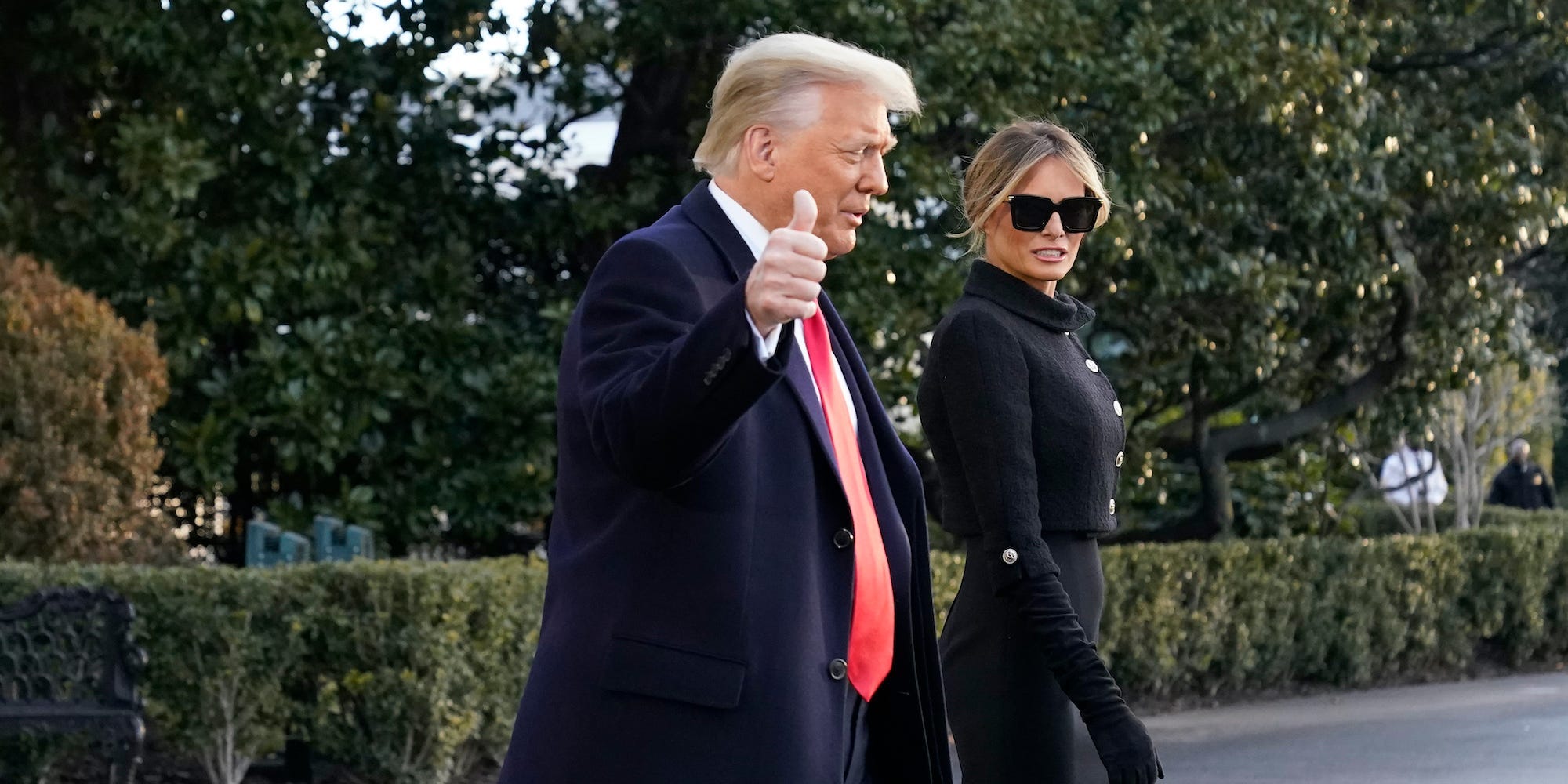 President Donald Trump and first lady Melania Trump walk to board Marine One on the South Lawn of the White House, Wednesday, Jan. 20, 2021, in Washington. Trump is en route to his Mar-a-Lago Florida Resort. (
