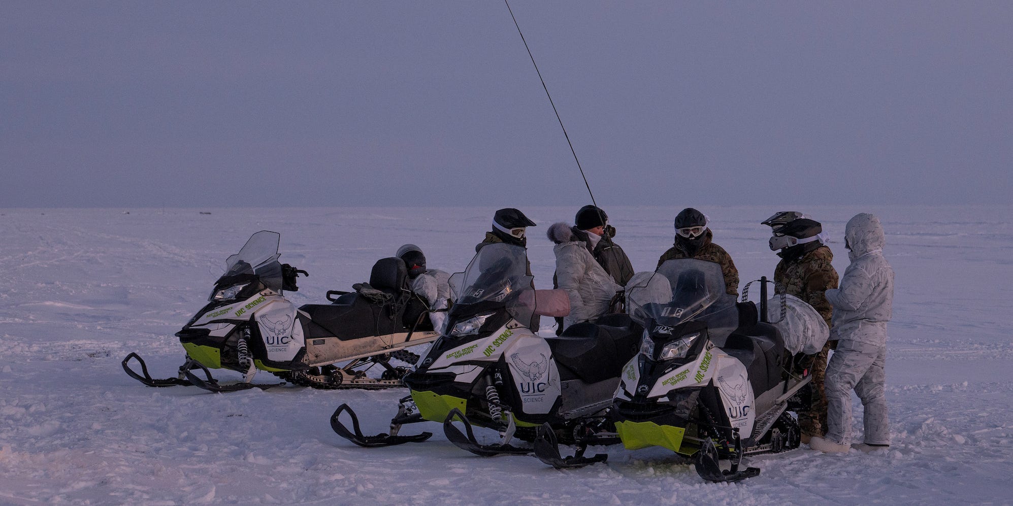 Air Force airmen exercise with snow mobiles in Alaska Arctic