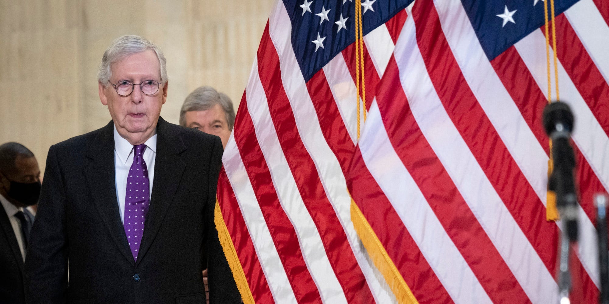 Senate Minority Leader Mitch McConnell arrives for a news conference on Capitol Hill on February 1, 2022.