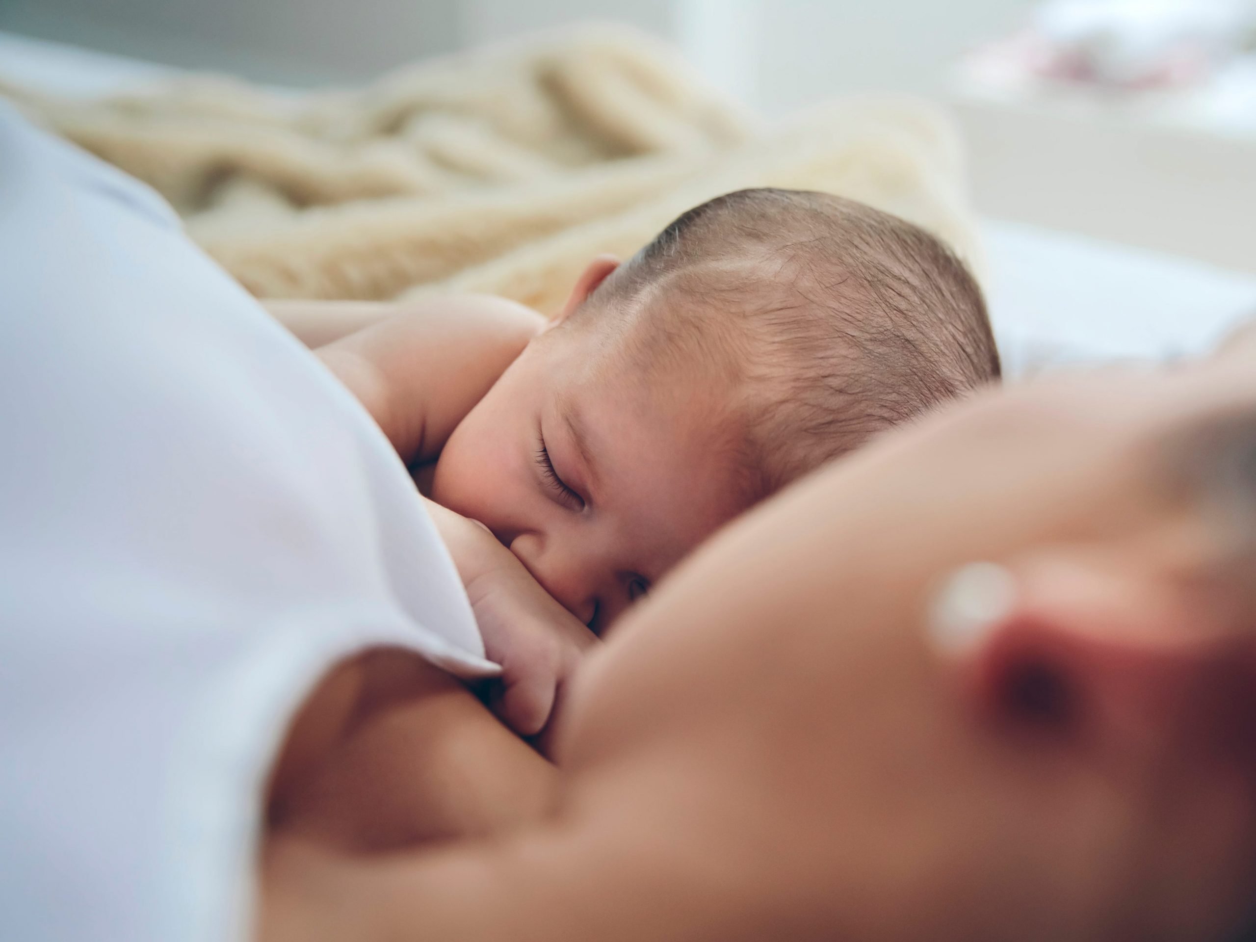 Mother and baby in bed