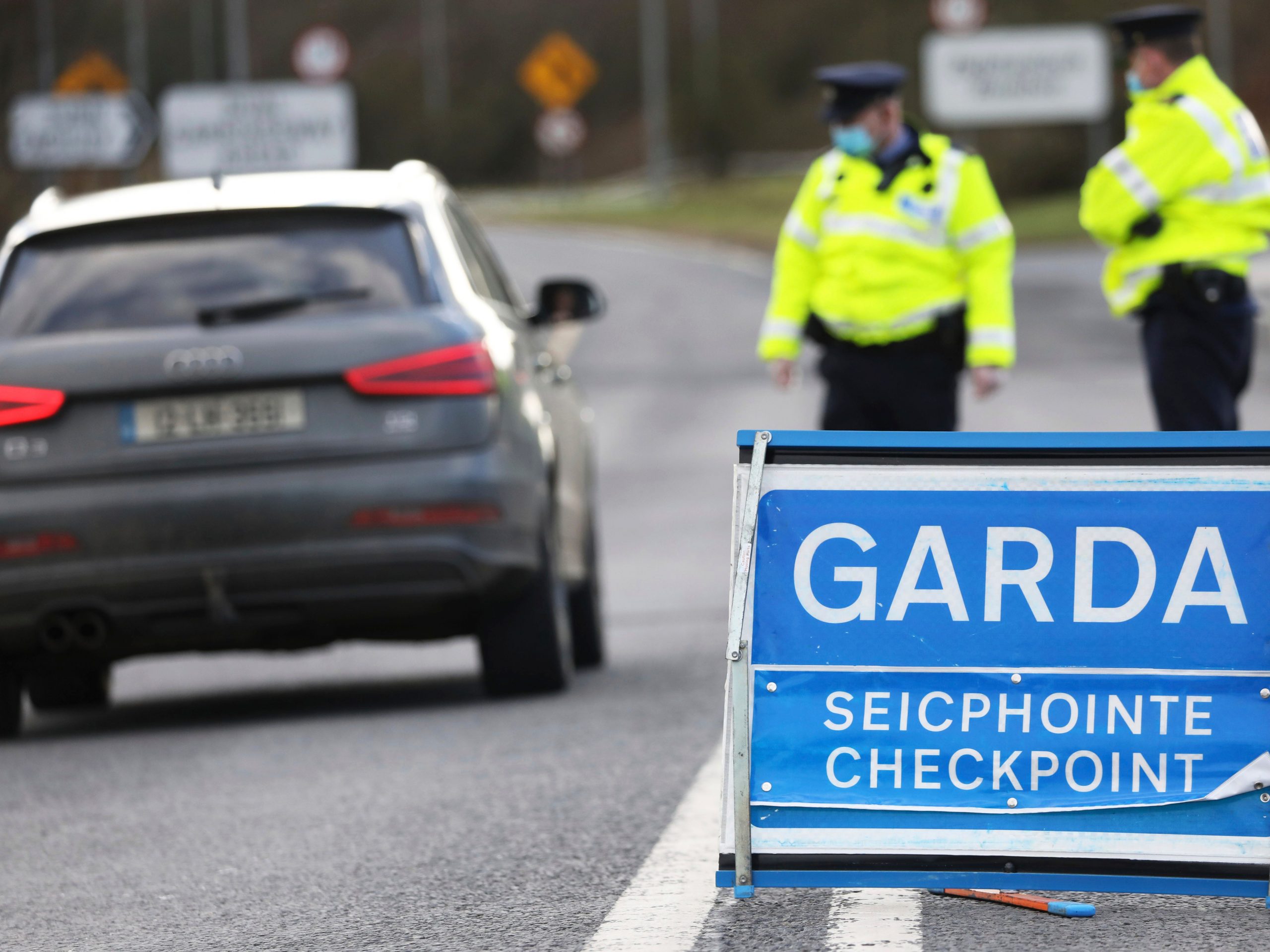 Garda Siochana (Irish Police), patrol a checkpoint close to the Irish border in Ravensdale, Ireland, Monday, Feb. 8, 2021. Checkpoints were set up across the country close to the border to stop people travelling from Northern Ireland into the Republic to enforce the new Covid-19 regulations.