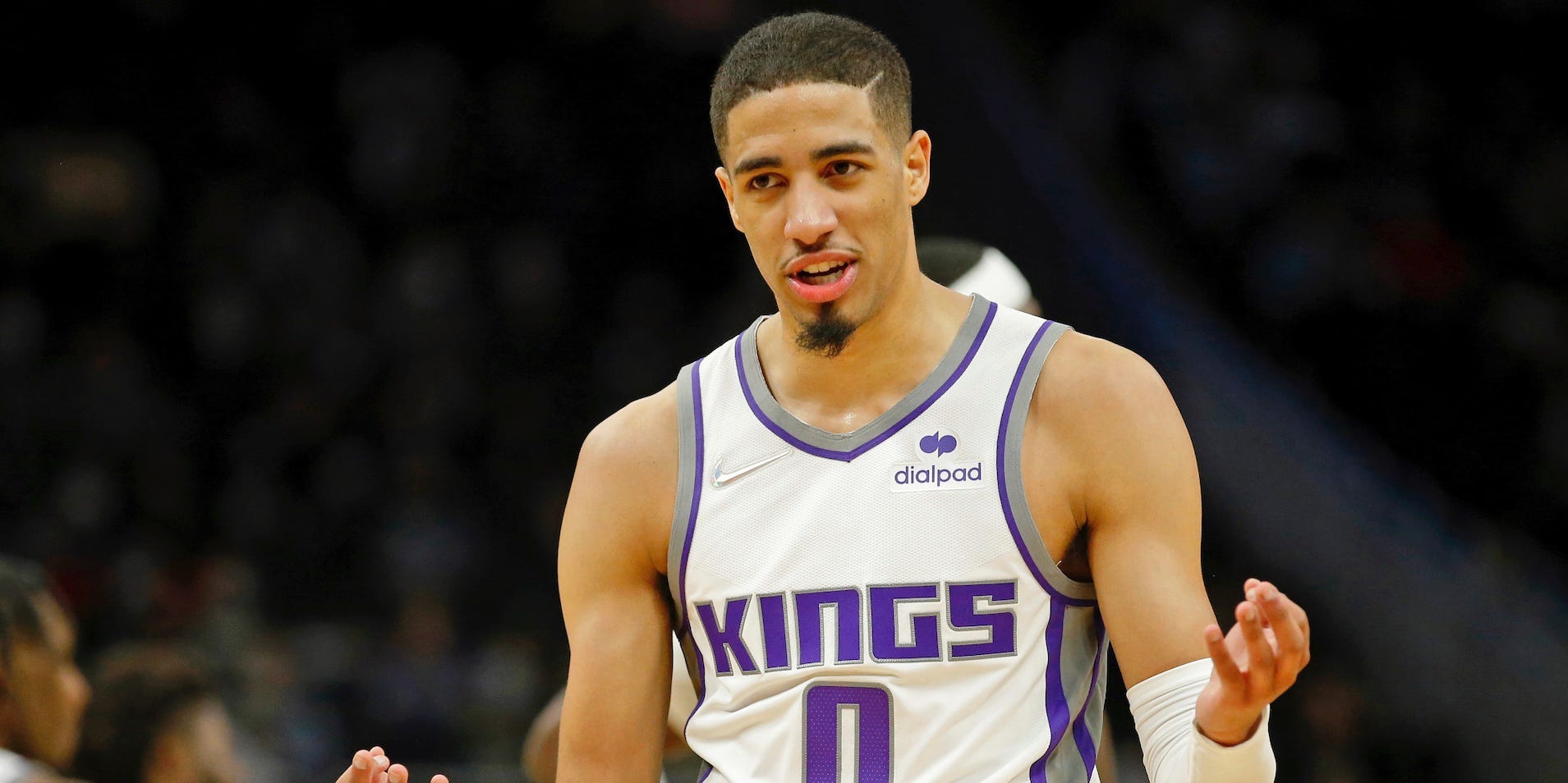 Tyrese Haliburton holds up his hands and reacts during a game in 2022.