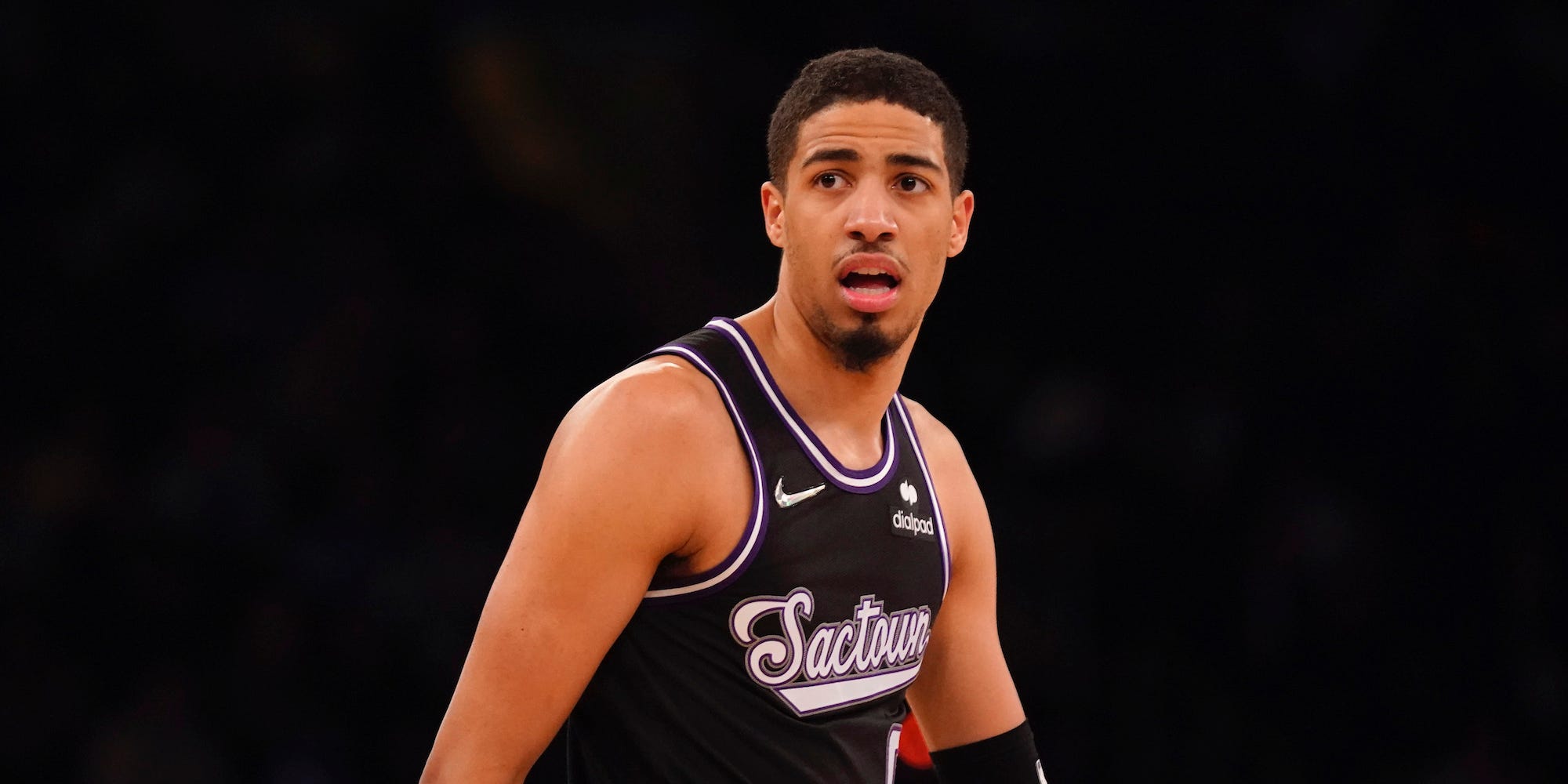 Tyrese Haliburton looks on during a Kings game in 2022.