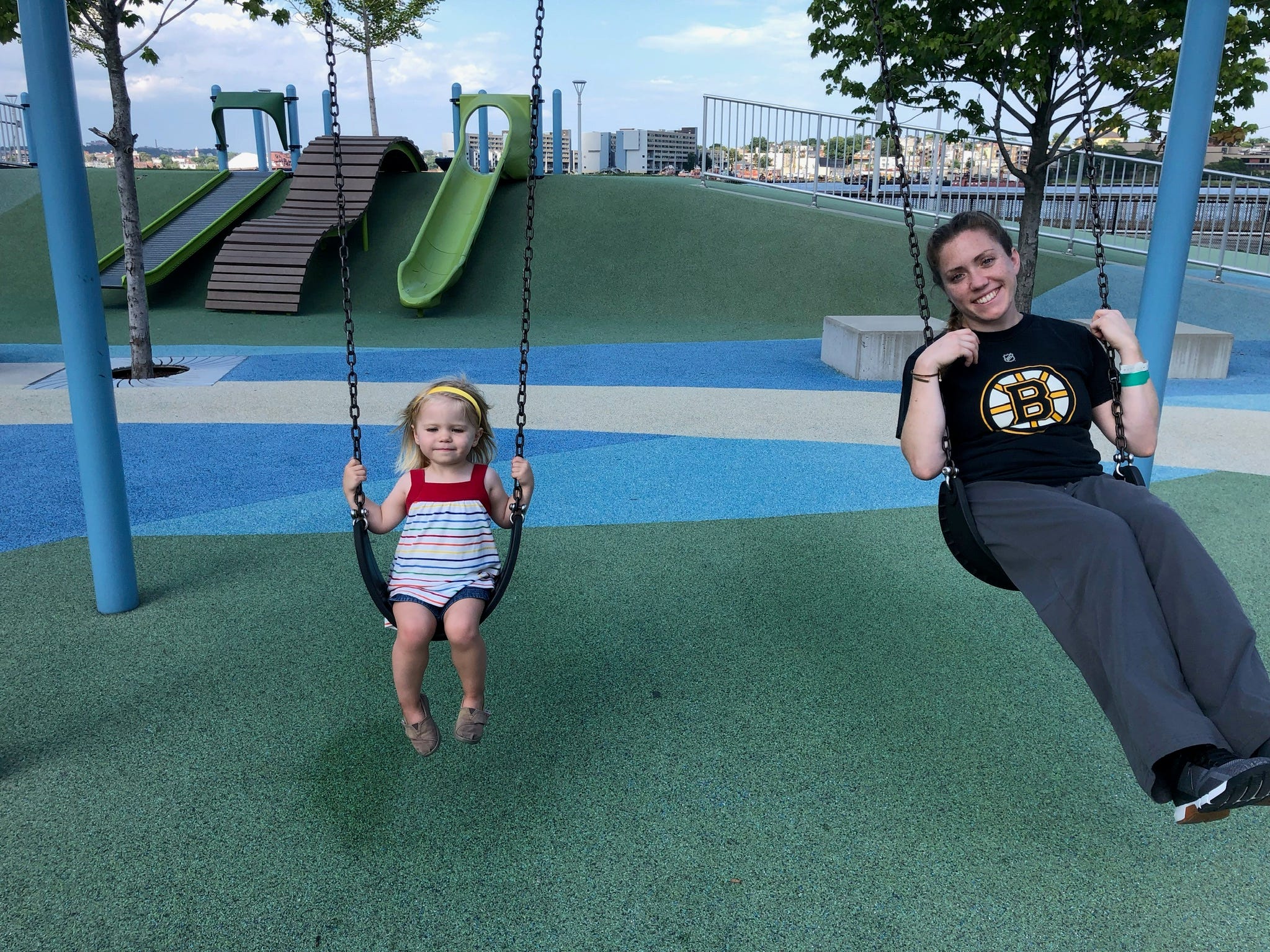 Jayme Kelly swings with Emma, whom she helps with different therapies.