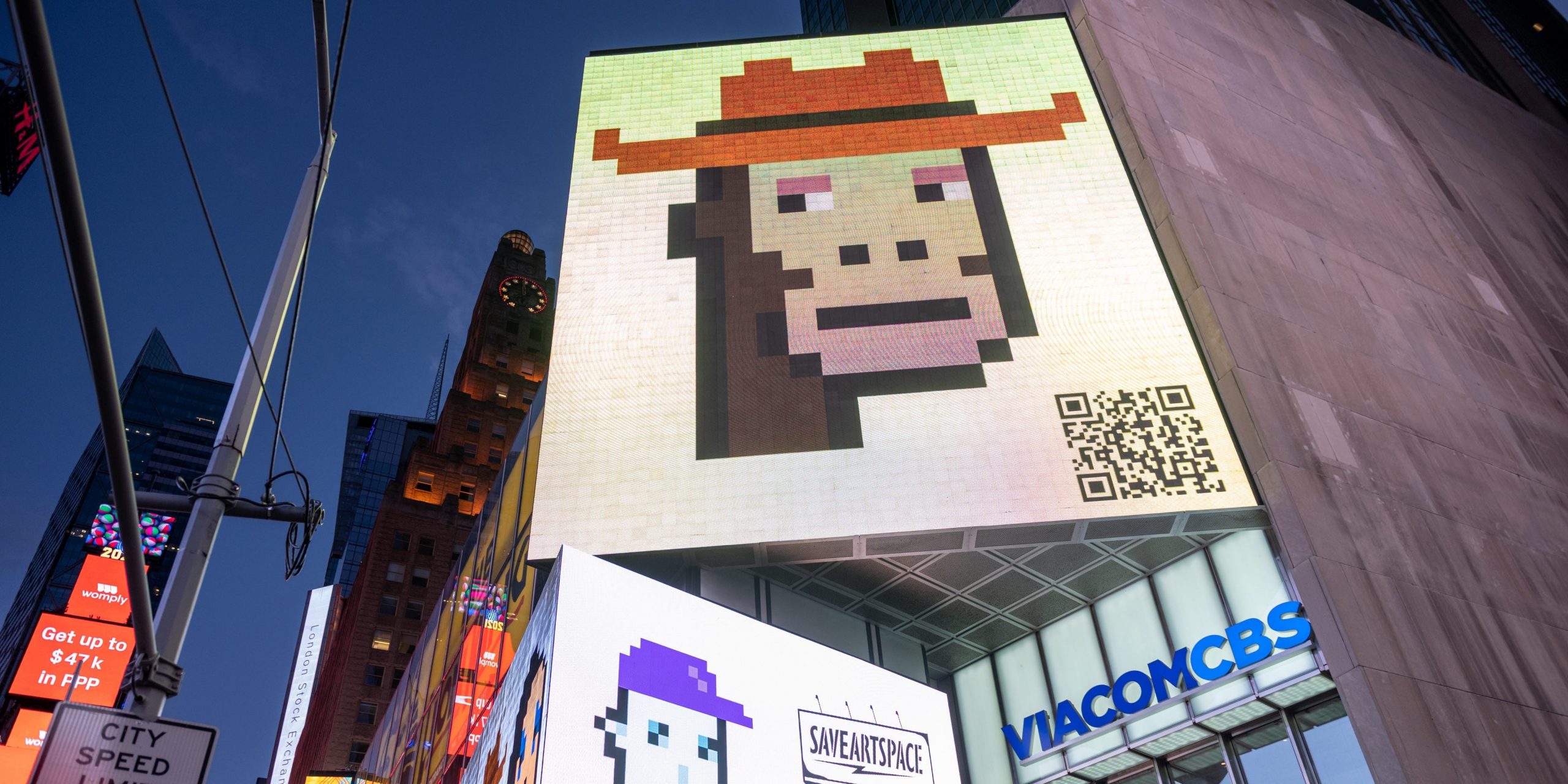 CryptoPunk digital art non-fungible token (NFT) displayed on a digital billboard in Times Square on May 12, 2021 in New York City.